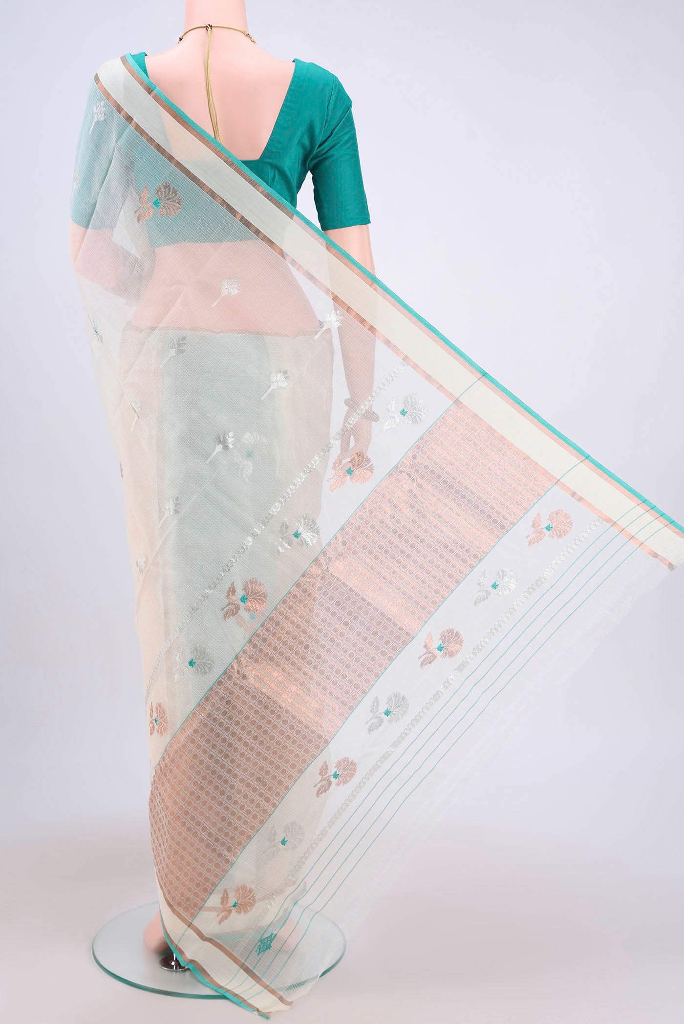 Flat view of Pure Silk Pure Zari Mint Green Kota Cotton Saree with Zari And Thread Butta on the body and Zari Border. 