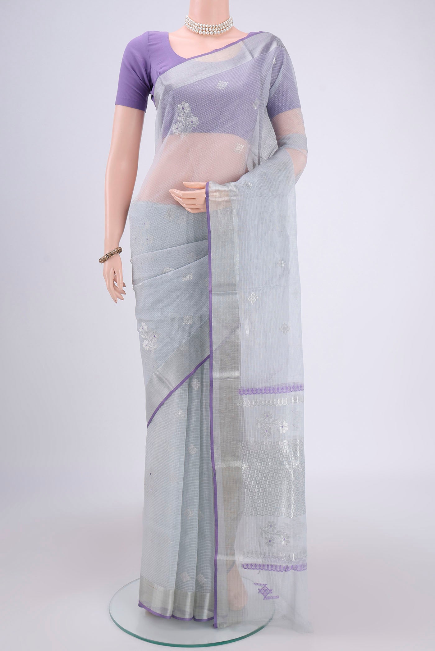 Pure Silk Pure Zari Grey Kota Saree with Zari Butta on the body and Zari Border.  displayed on a mannequin