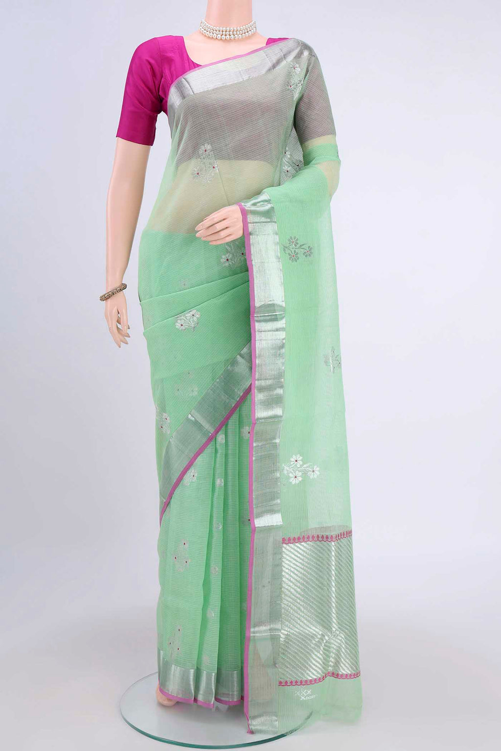 Pure Silk Pure Zari Mint Green Kota Saree with Zari Butta on the body and Zari Border displayed on a mannequin