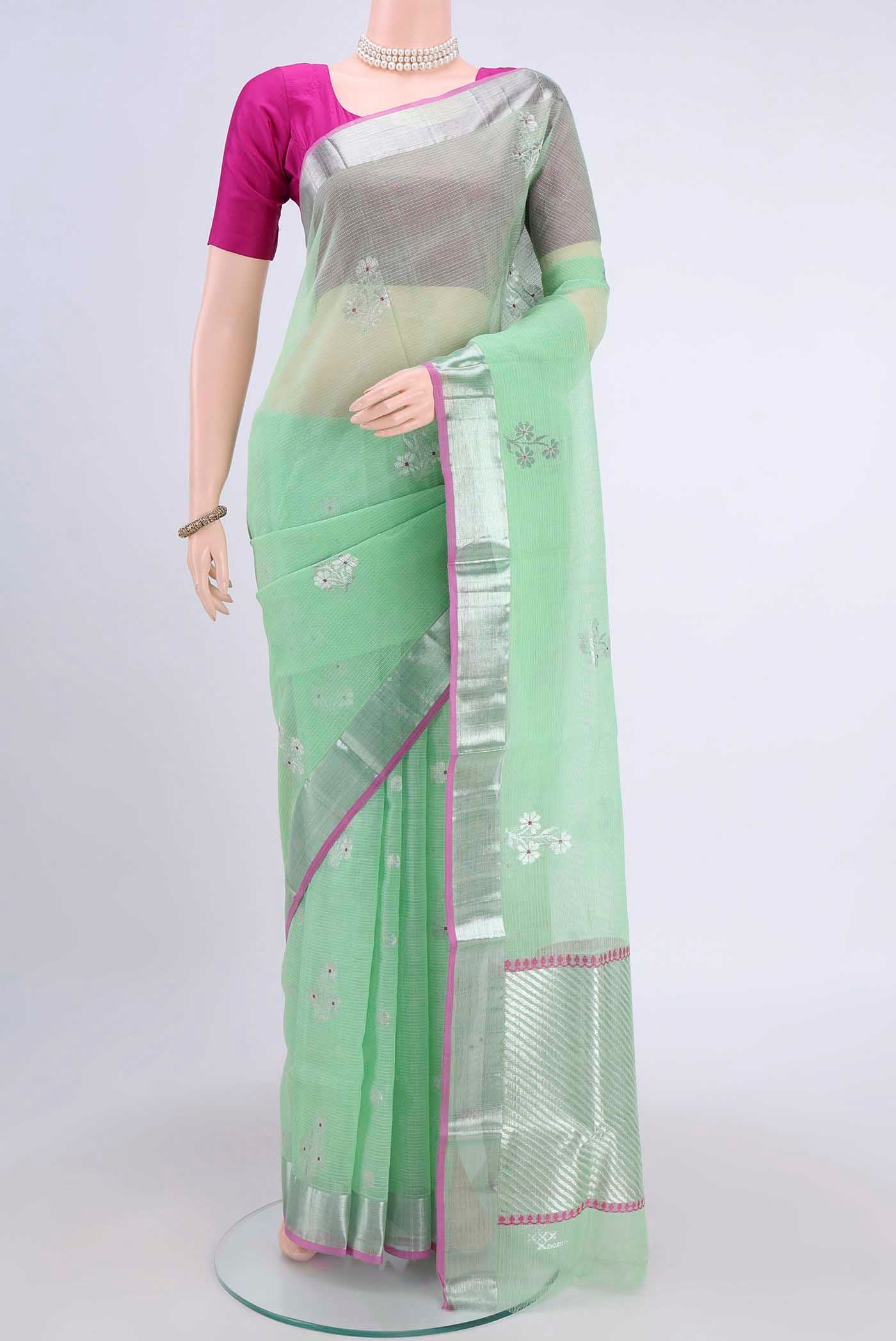Pure Silk Pure Zari Mint Green Kota Saree with Zari Butta on the body and Zari Border displayed on a mannequin
