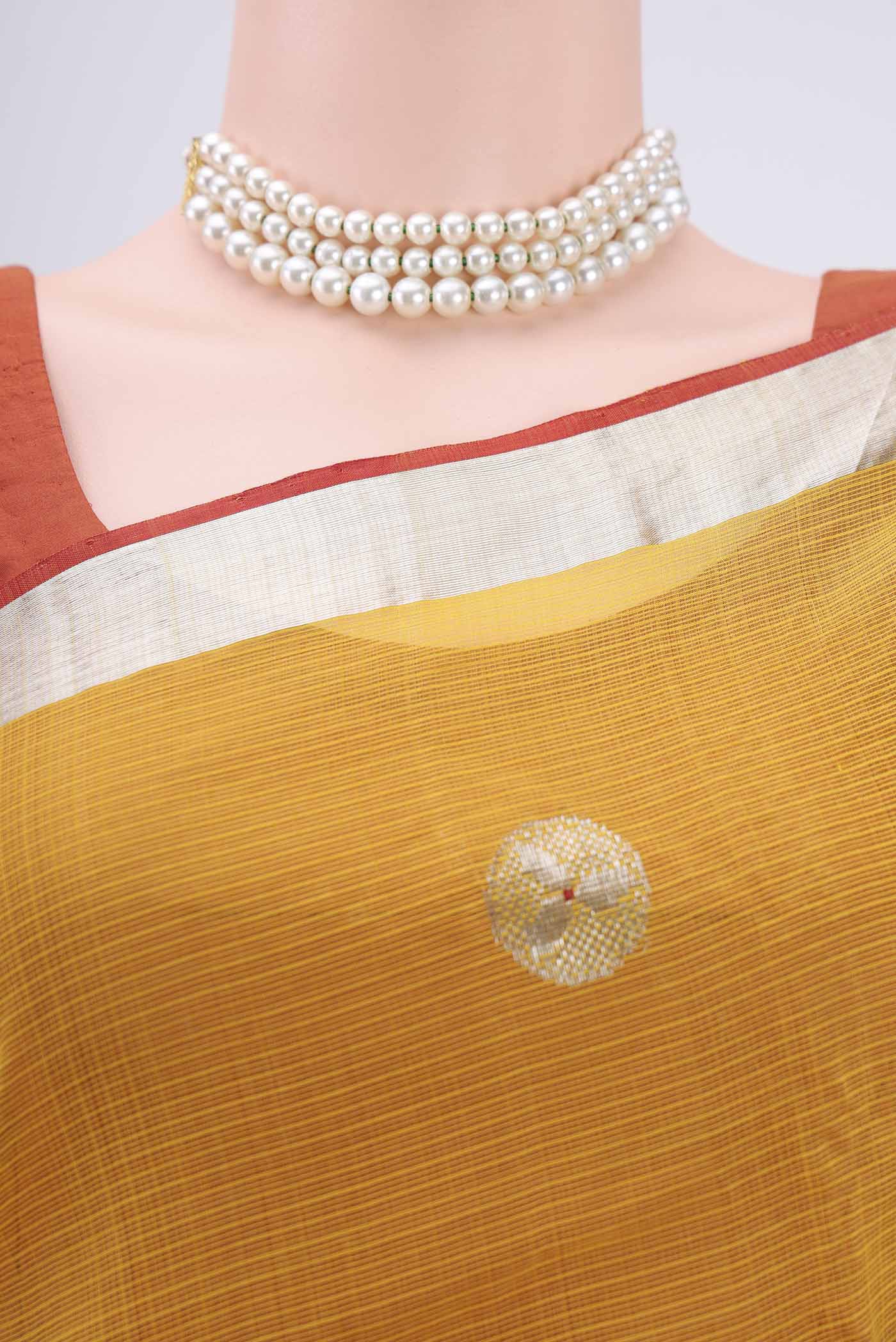 Border image of Pure Silk Pure Zari Cream Kota Saree with Zari Butta on the body and Zari Border. 