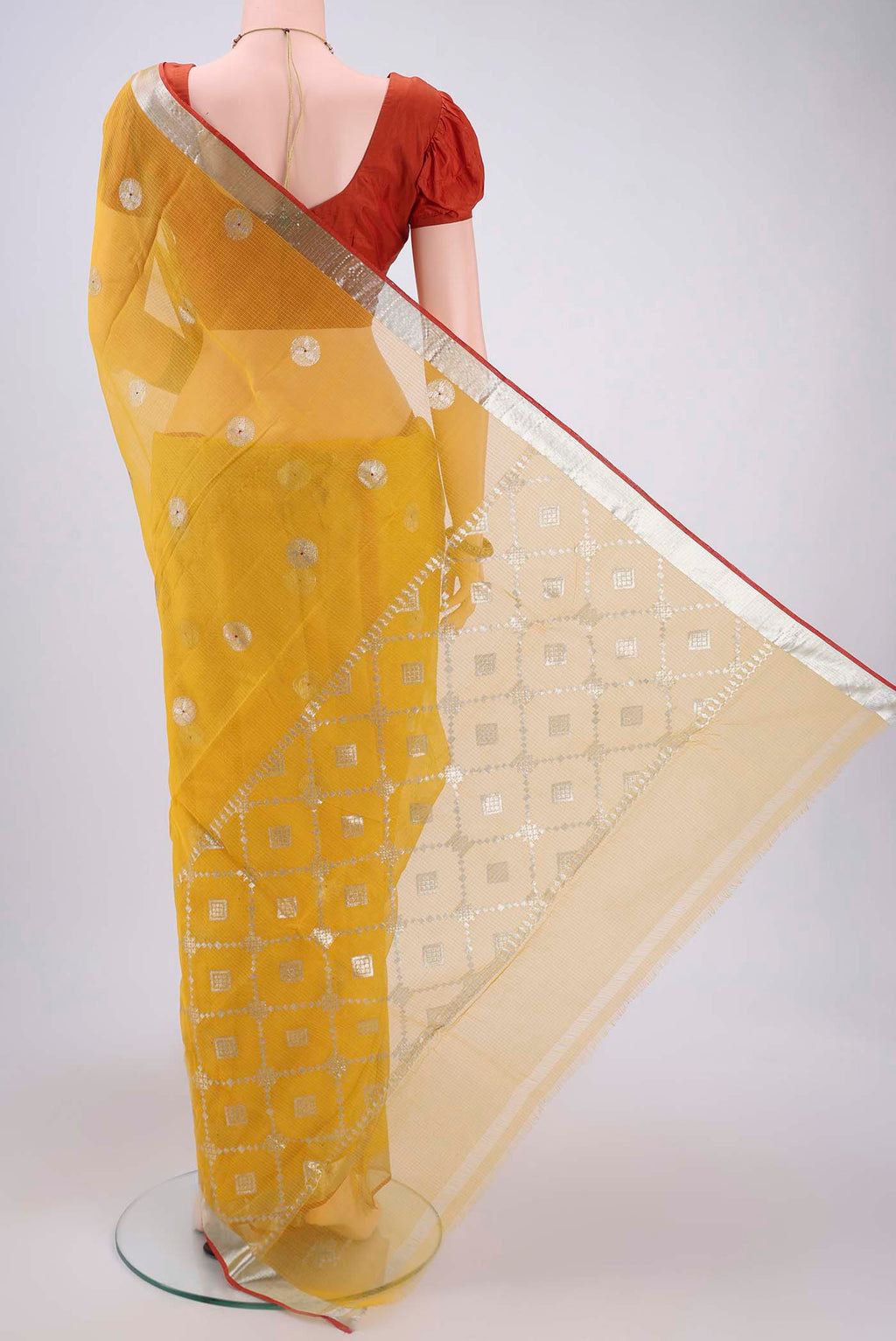 Flat view of Pure Silk Pure Zari Cream Kota Saree with Zari Butta on the body and Zari Border. 