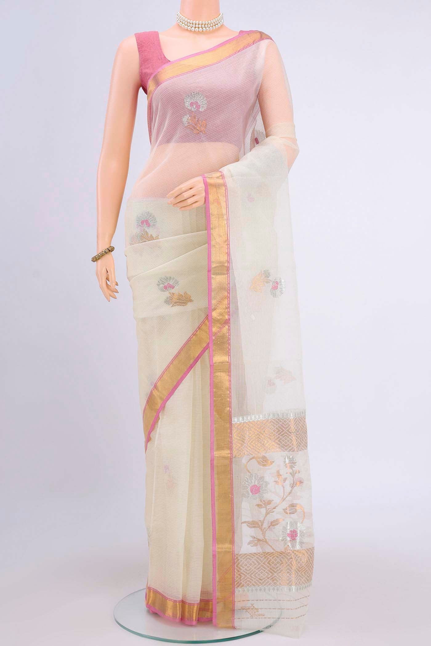Pure Silk Pure Zari Off White Kota Saree with Zari And Thread Butta on the body and Zari Border displayed on a mannequin