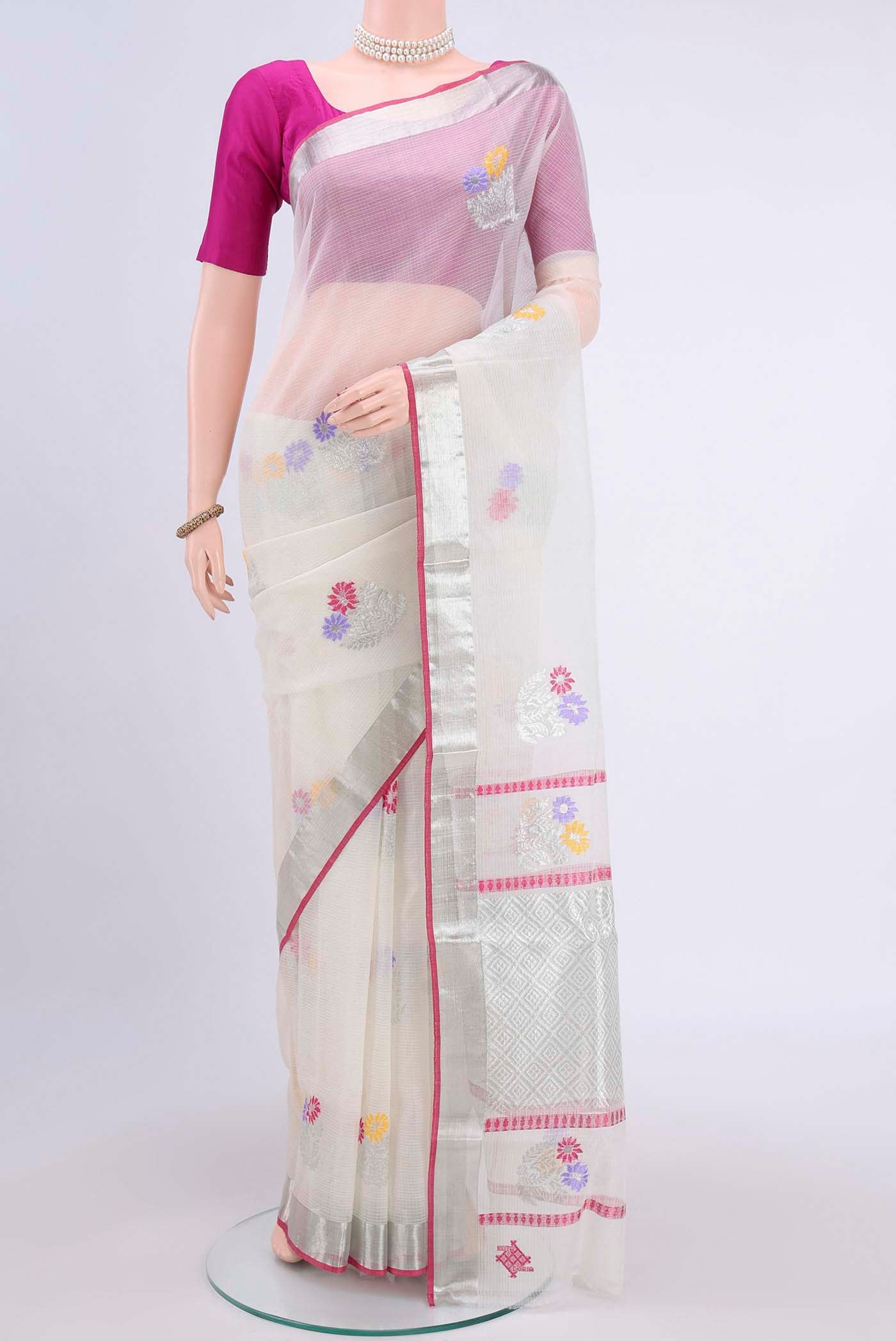 Pure Silk Pure Zari Off White Kota Saree with Zari And Thread Butta on the body and Zari Border displayed on a mannequin