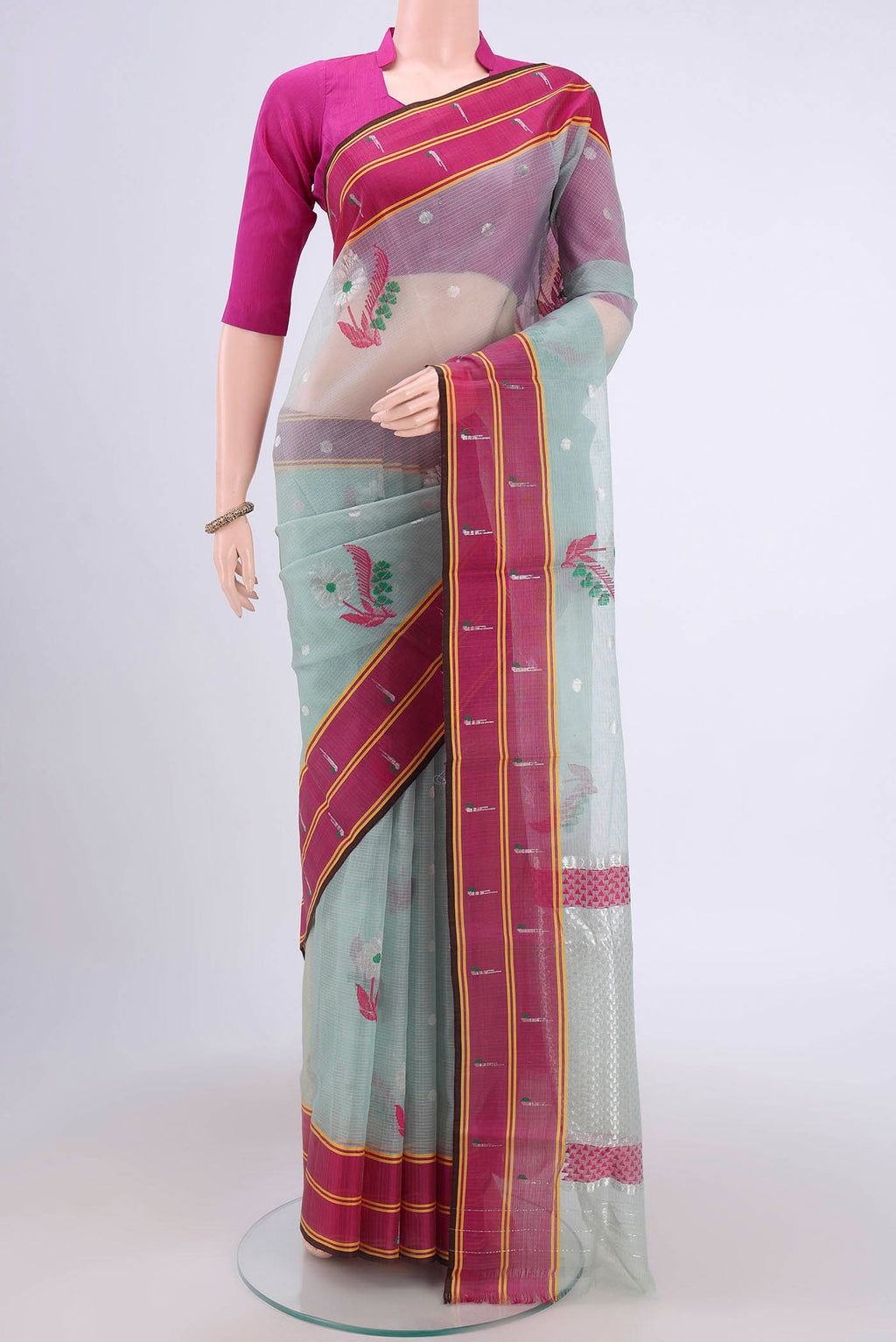 Pure Silk Pure Zari Grey Kota Cotton Saree with Zari And Thread Butta on the body and Zari Border.  displayed on a mannequin