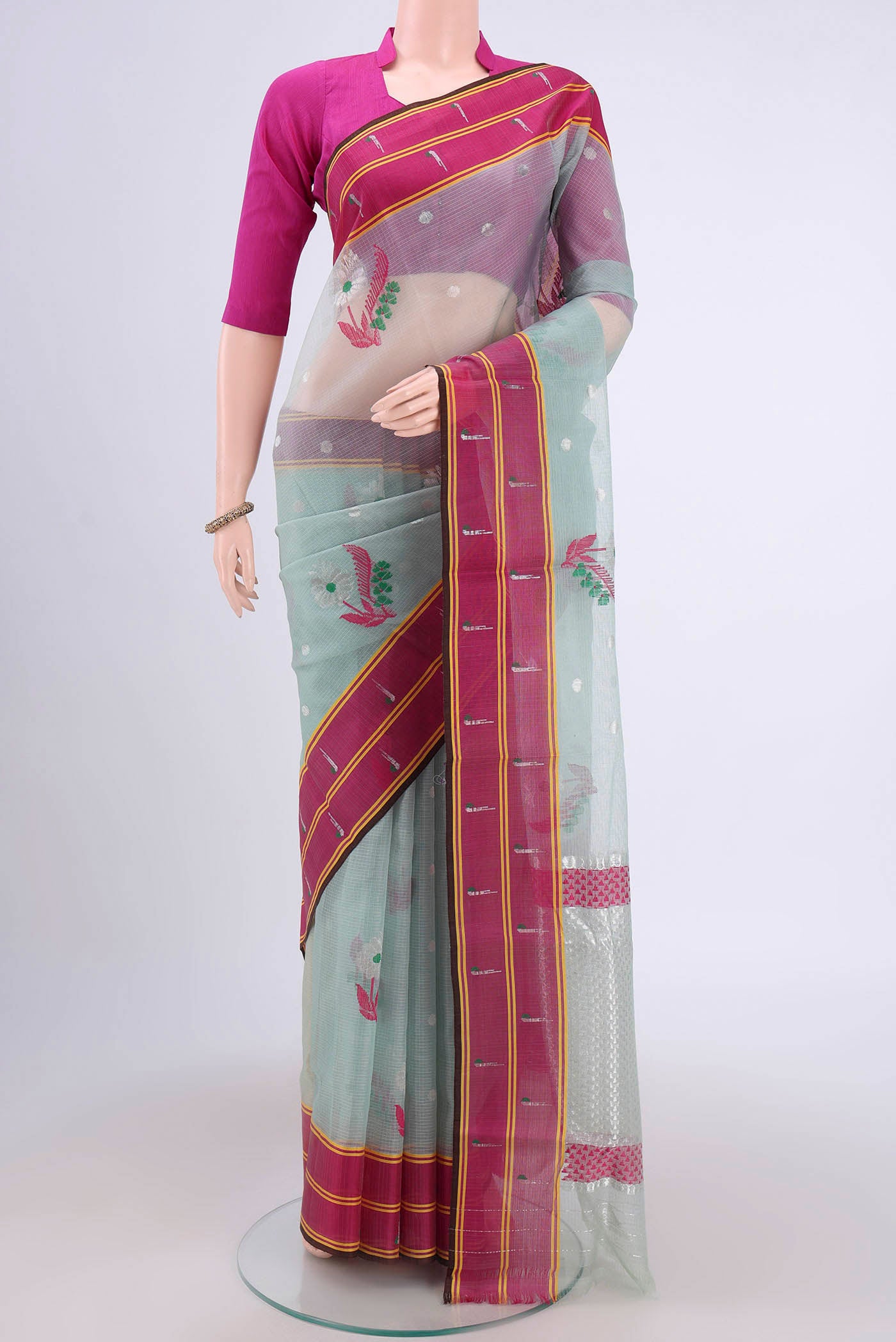 Pure Silk Pure Zari Grey Kota Cotton Saree with Zari And Thread Butta on the body and Zari Border.  displayed on a mannequin