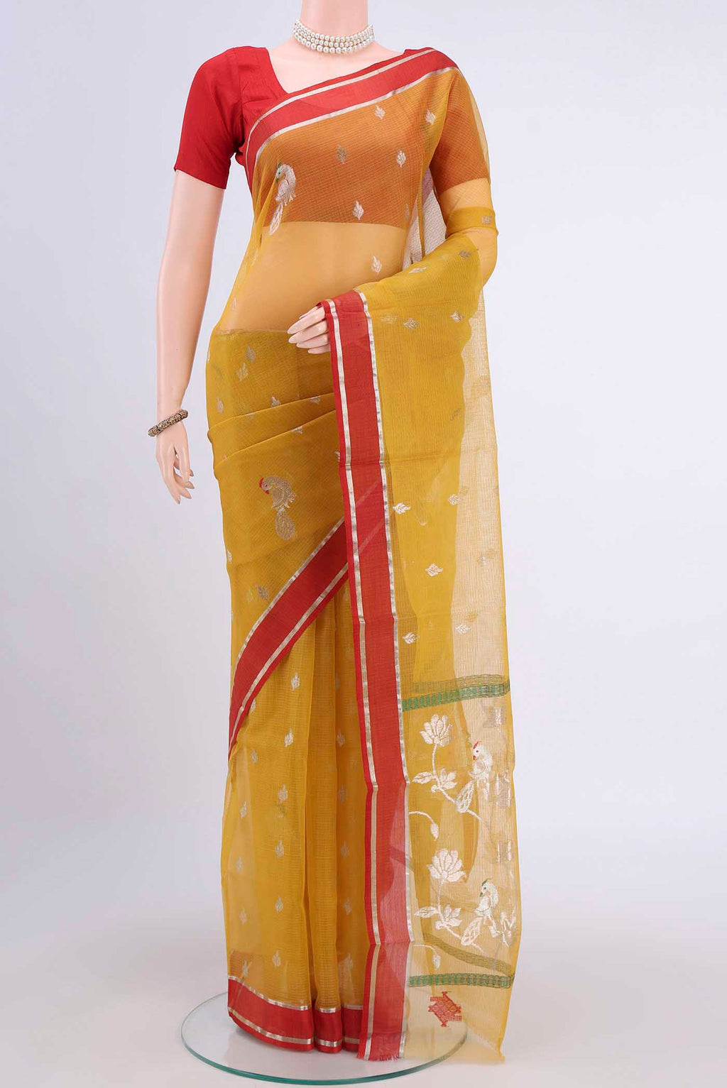 Pure Silk Pure Zari Mustard Kota Saree with Zari And Thread Butta on the body and Zari Border displayed on a mannequin
