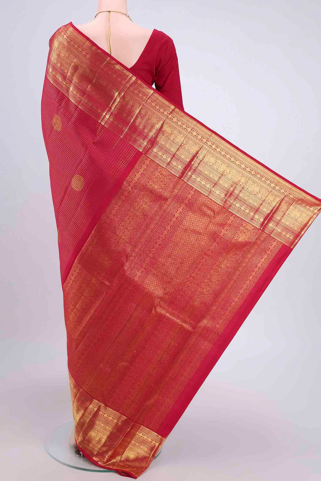 Flat view of Maroon Kanjivaram Saree with Checked design on the body and Zari Border. 