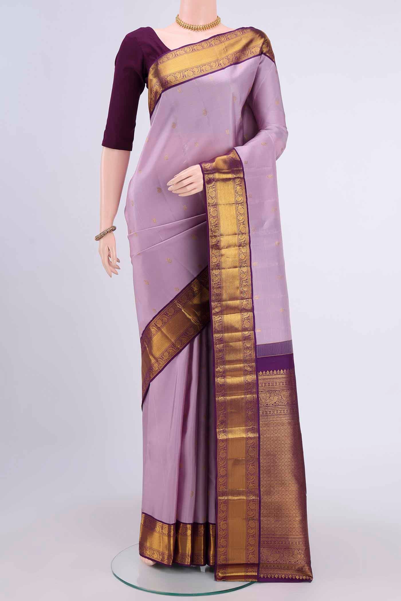Lavender Kanchipuram Silk Saree with Zari Butta on the body and Zari Border displayed on a mannequin