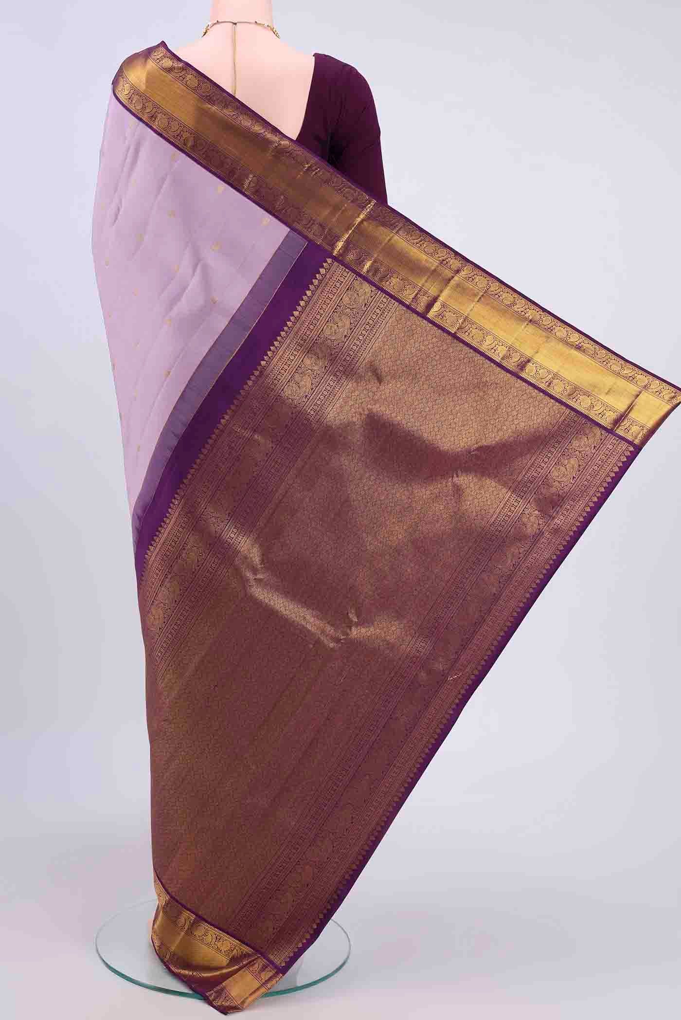 Flat view of Lavender Kanchipuram Silk Saree with Zari Butta on the body and Zari Border