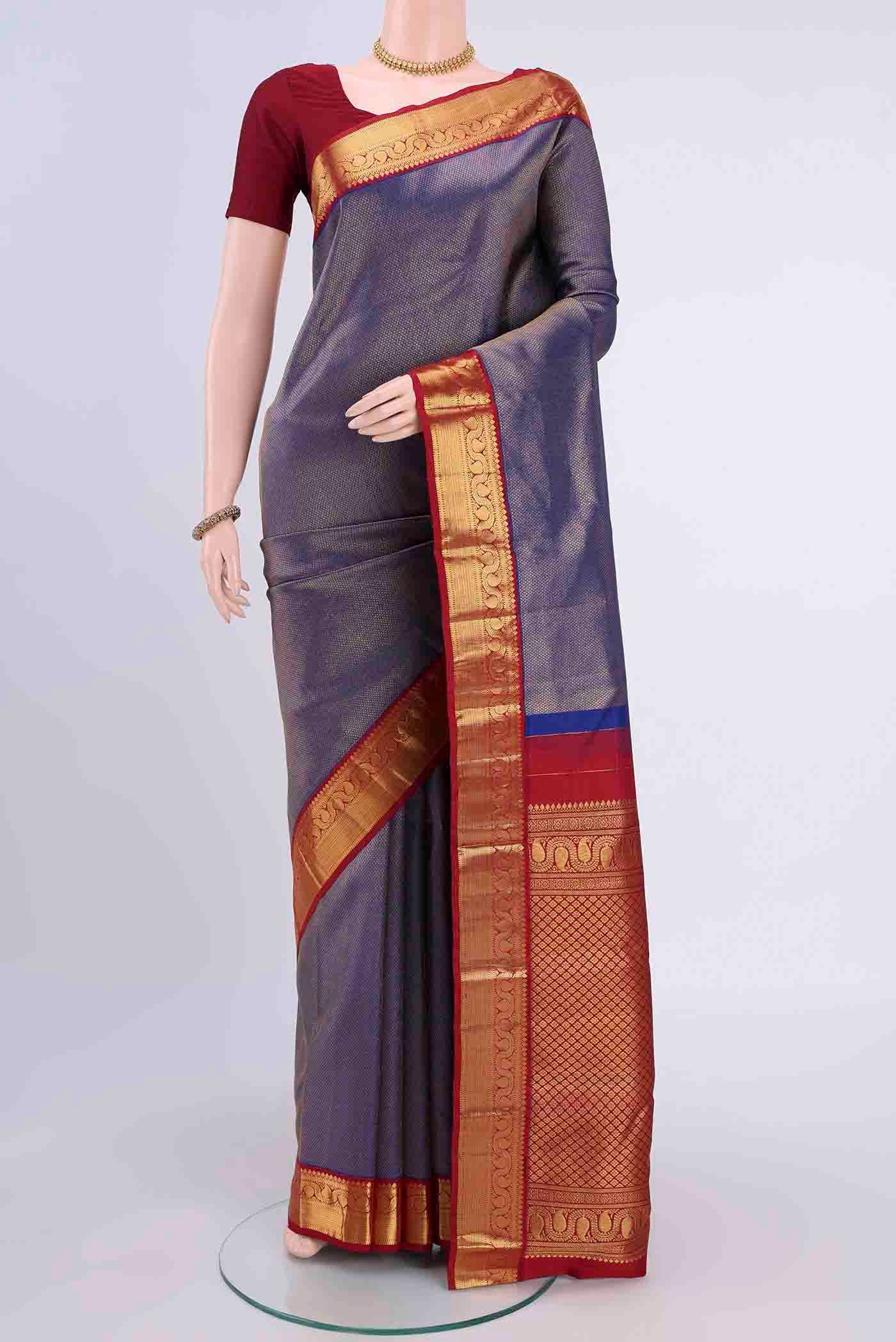 Navy Blue Kanchipuram Silk Saree with Zari Brocade on the body and Zari Border displayed on a mannequin