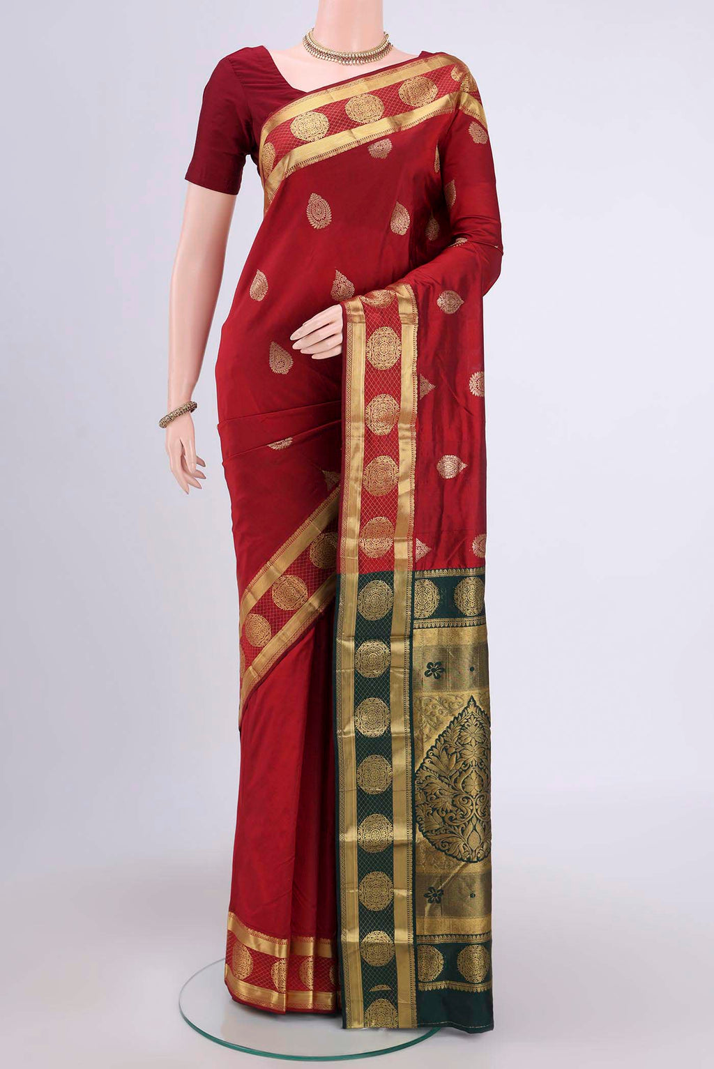 Maroon Blended Bangalore Silk Saree with Zari Butta on the body and Zari Border.  displayed on a mannequin