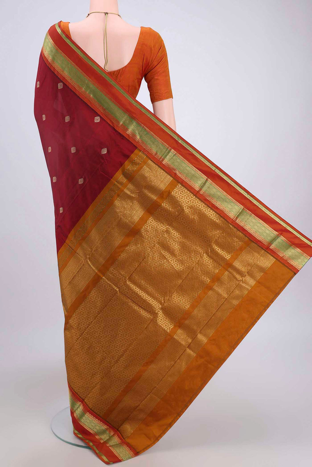 Flat view of Maroon Blended Bangalore Silk Saree with Zari Butta on the body and Zari Border. 