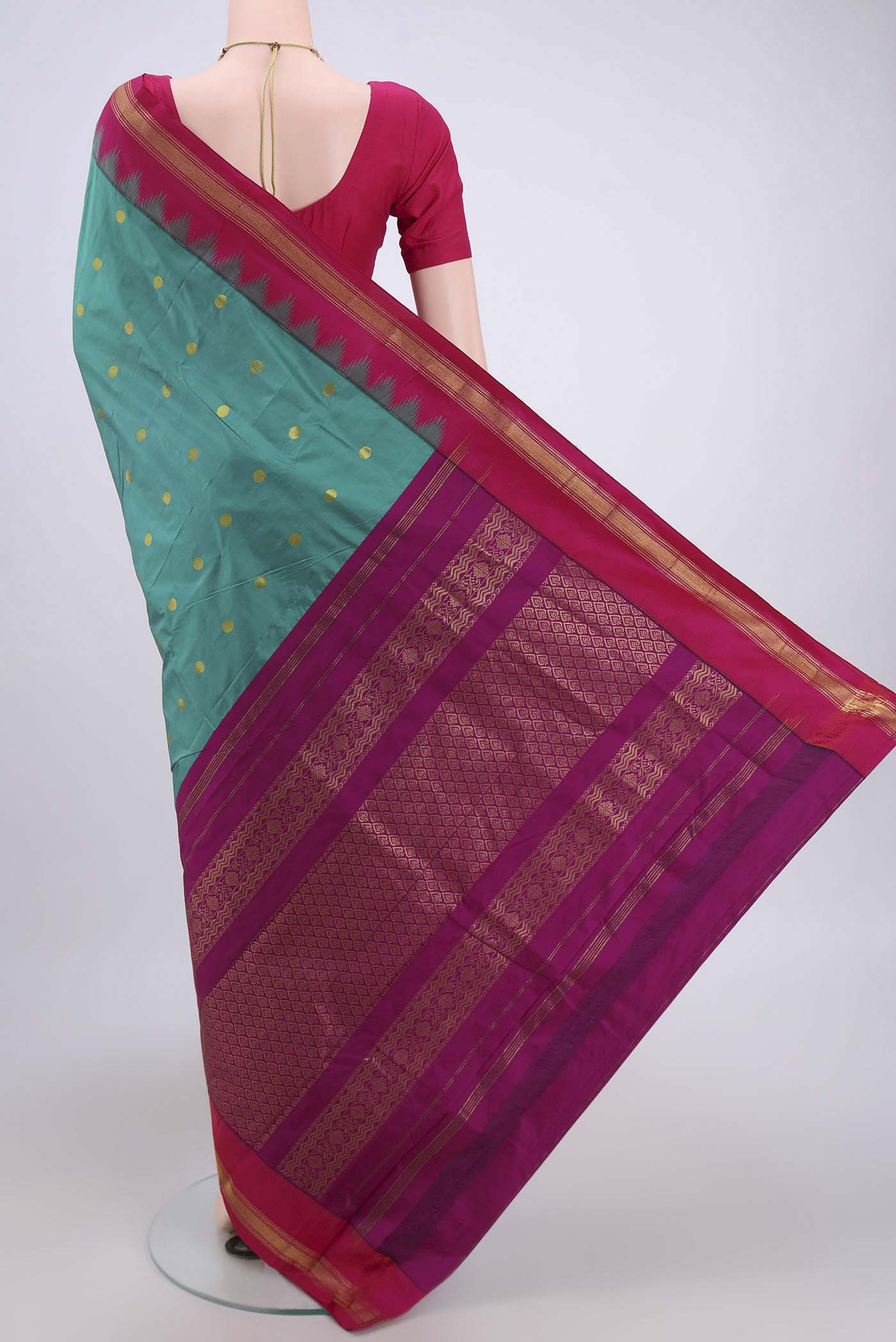 Flat view of Sea Green Blended Bangalore Silk Saree with Zari Butta on the body and Zari Border. 