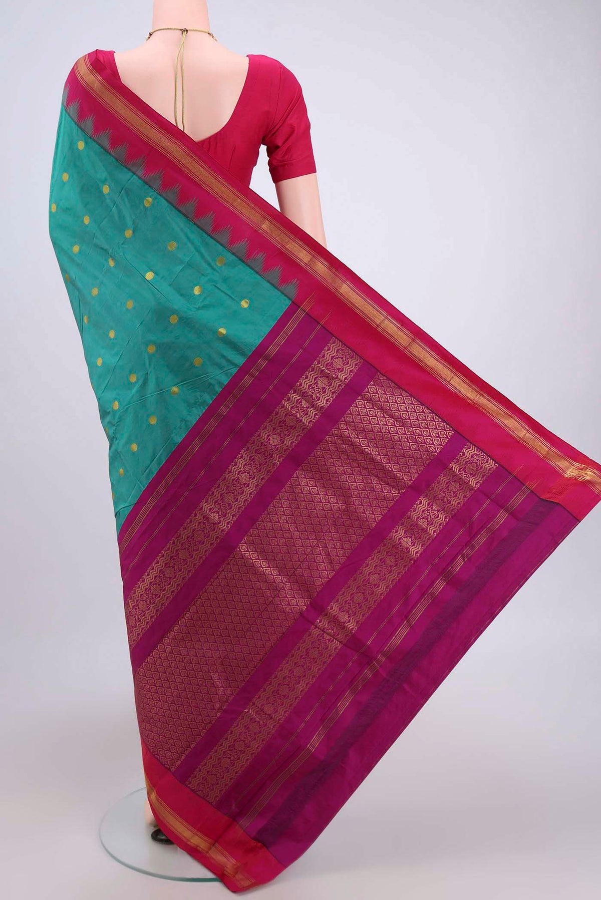 Flat view of Sea Green Blended Bangalore Silk Saree with Zari Butta on the body and Zari Border. 