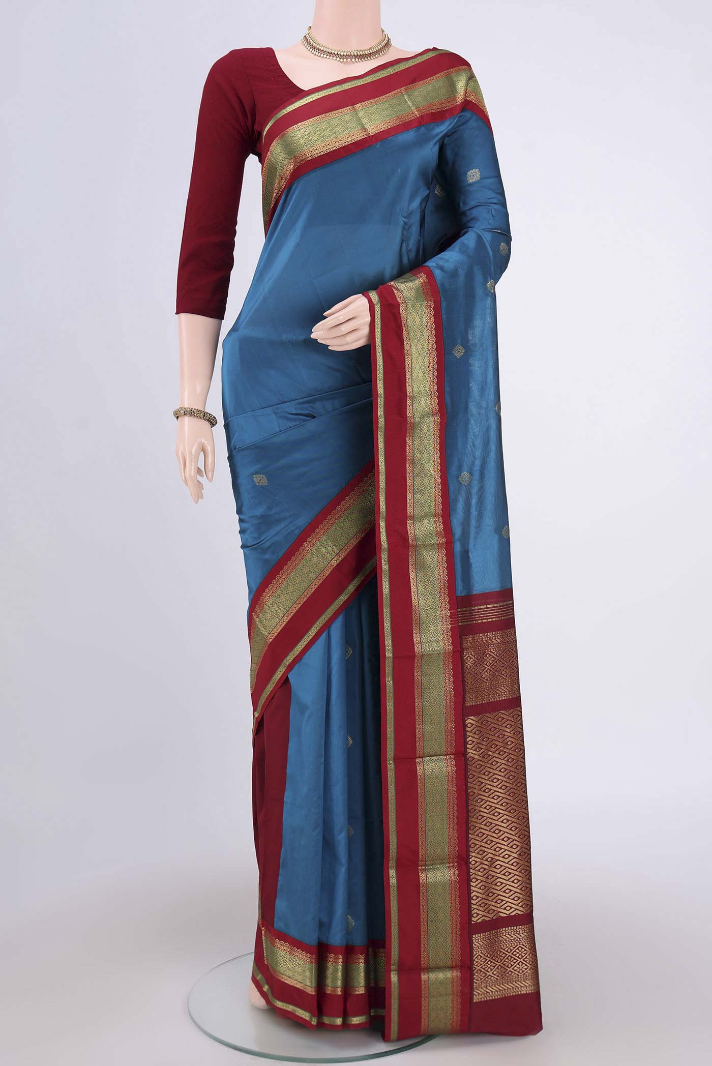 Dark Blue Blended Bangalore Silk Saree with Zari Butta on the body and Zari Border.  displayed on a mannequin