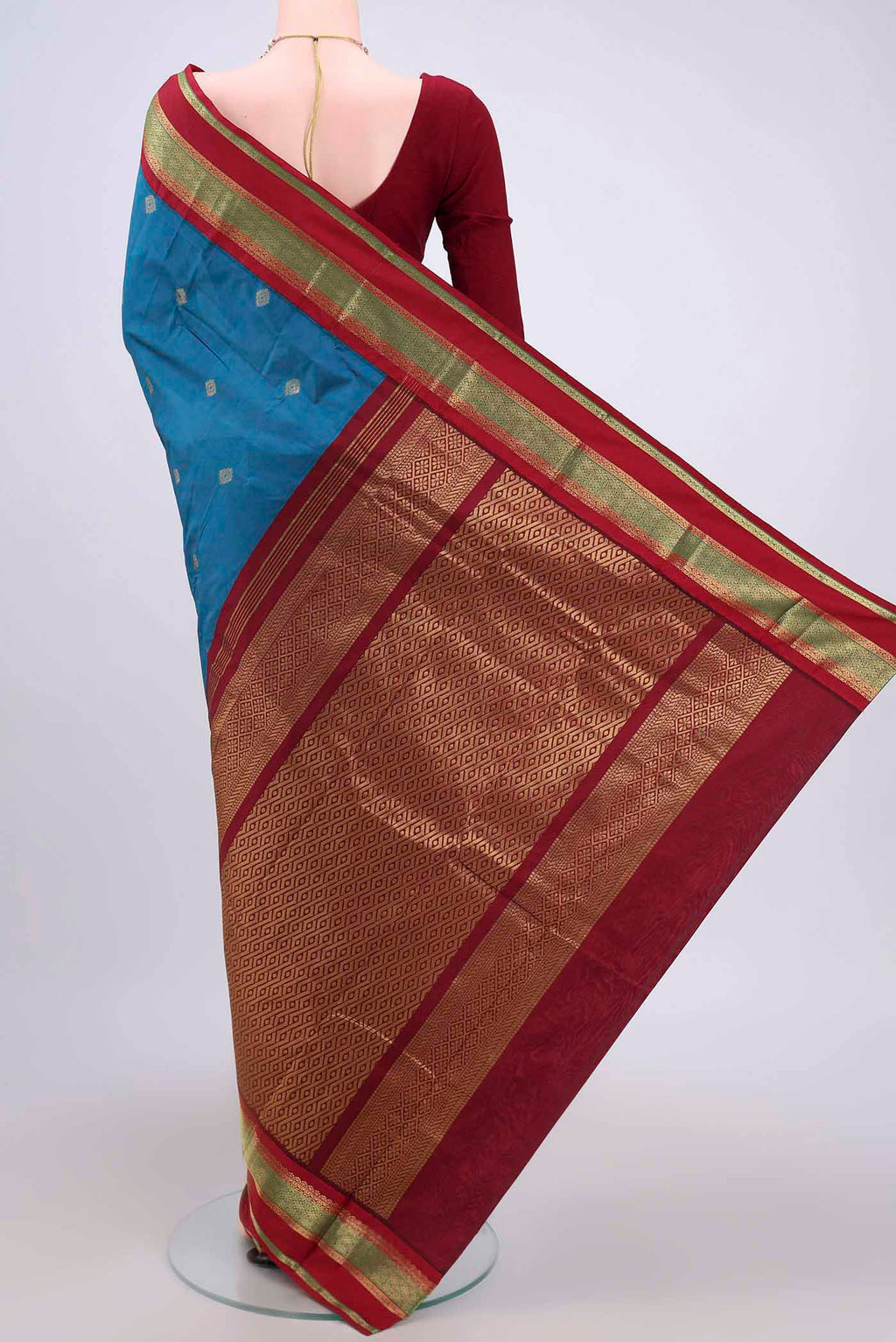 Flat view of Dark Blue Blended Bangalore Silk Saree with Zari Butta on the body and Zari Border. 