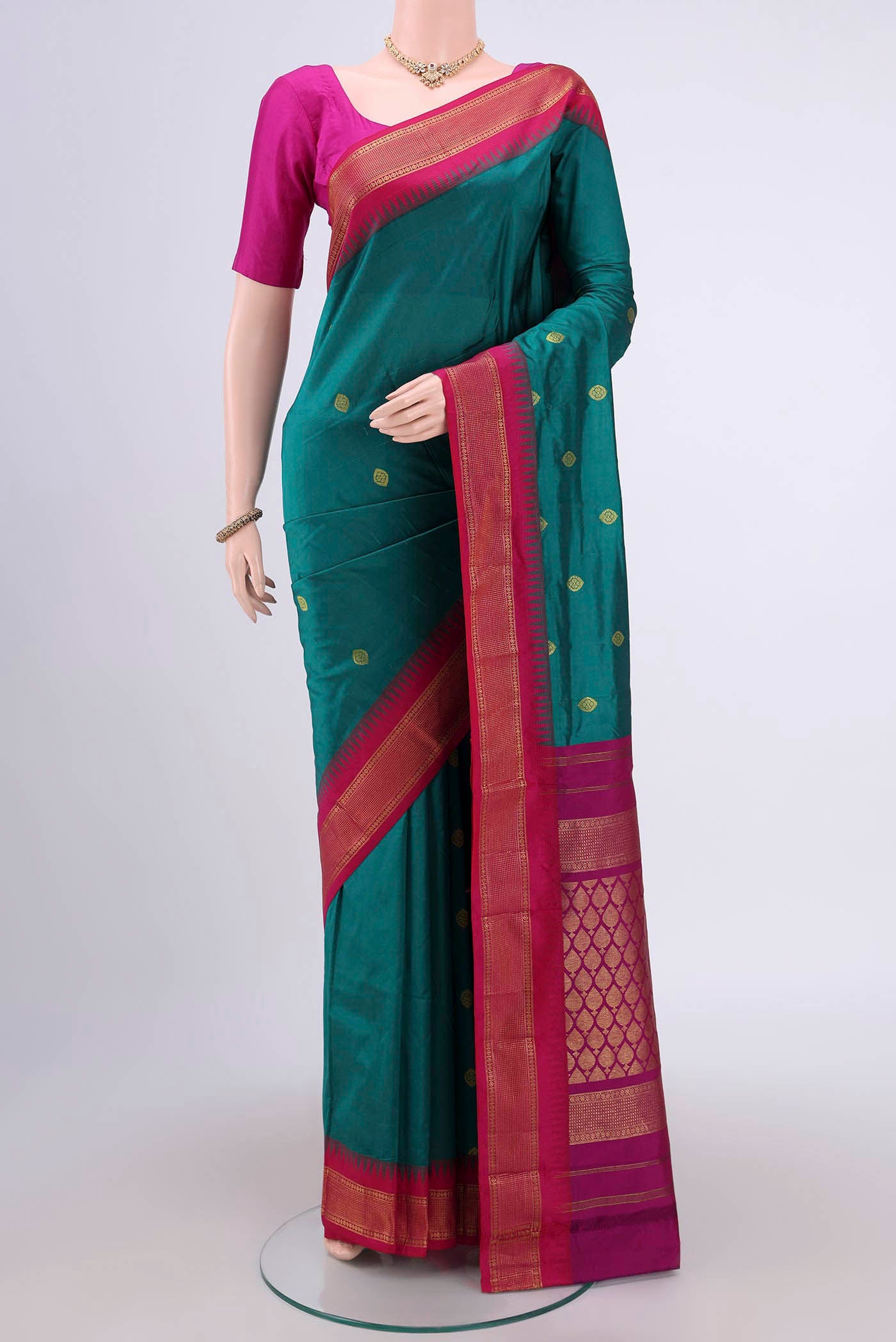 Sea Green Dual Tone Blended Bangalore Silk Saree with Zari Butta on the body and Temple Border.  displayed on a mannequin