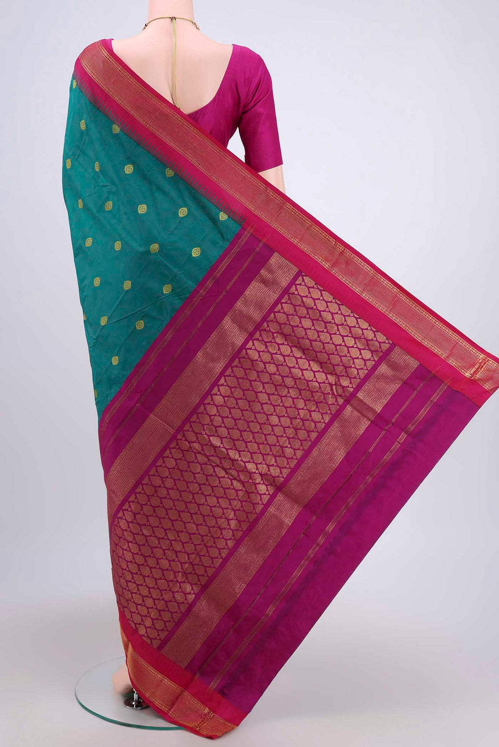 Flat view of Sea Green Dual Tone Blended Bangalore Silk Saree with Zari Butta on the body and Temple Border. 