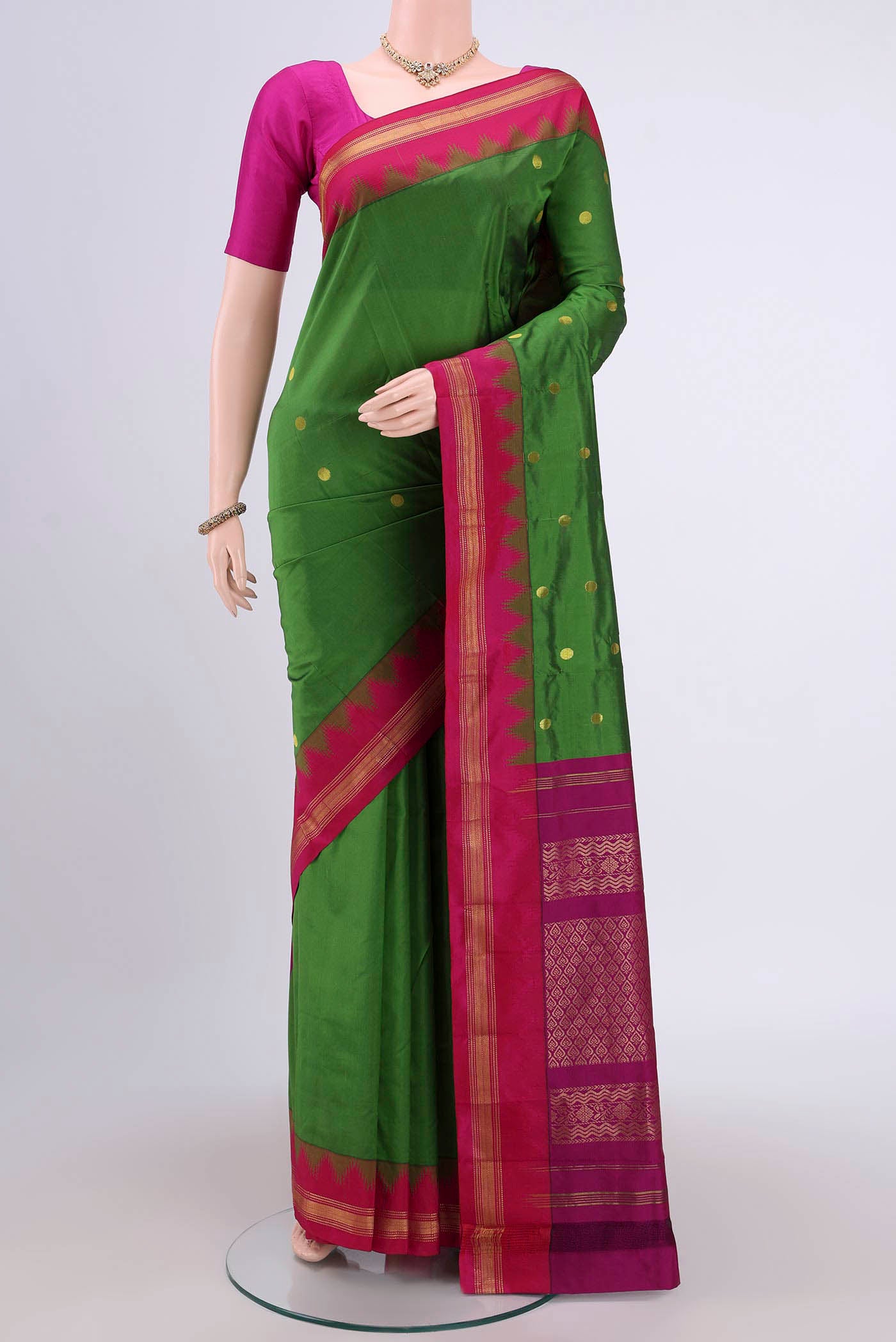 Green Dual Tone Blended Bangalore Silk Saree with Zari Butta on the body and Temple Border.  displayed on a mannequin
