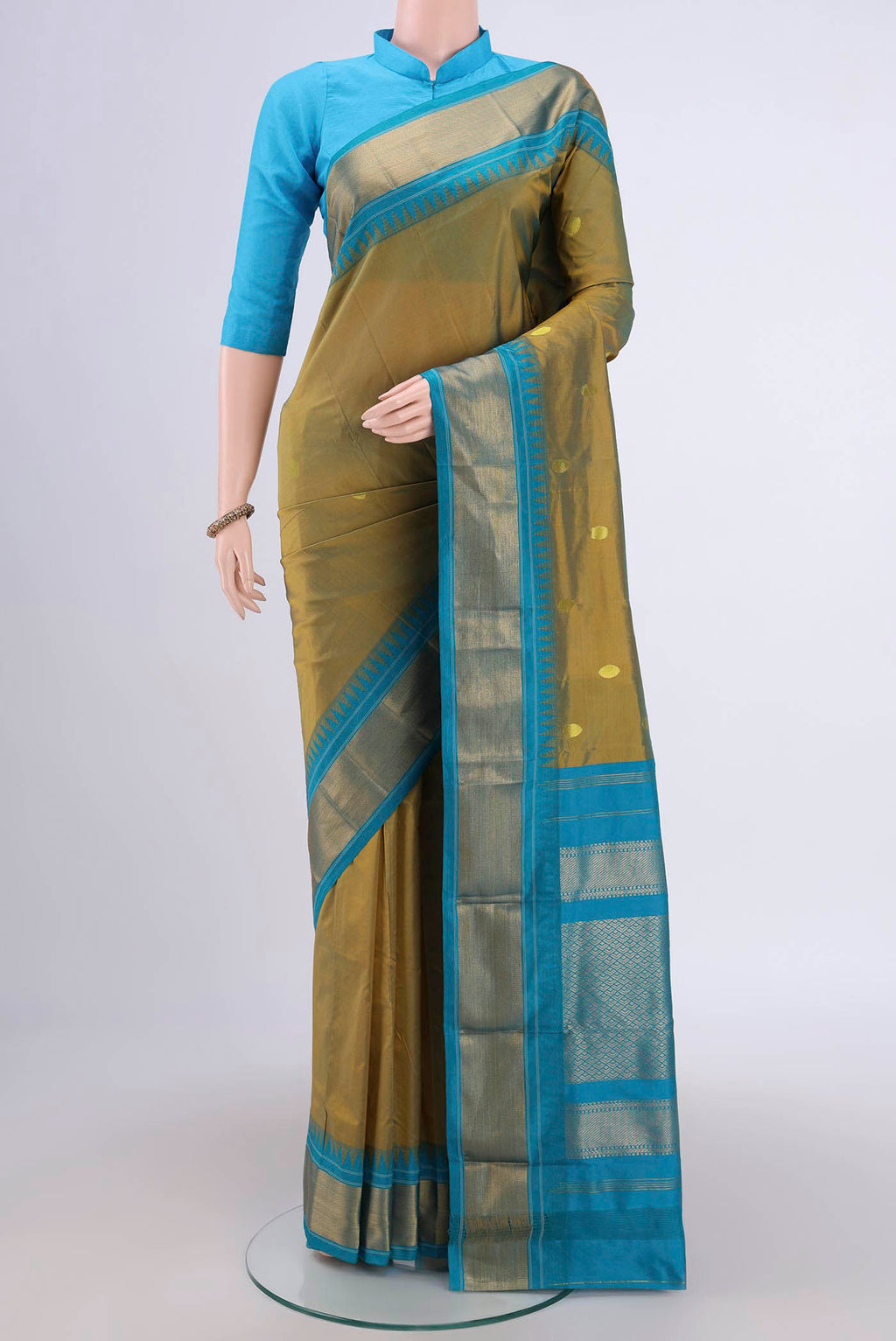 Light Green Dual Tone Blended Bangalore Silk Saree with Zari Butta on the body and Temple Border.  displayed on a mannequin