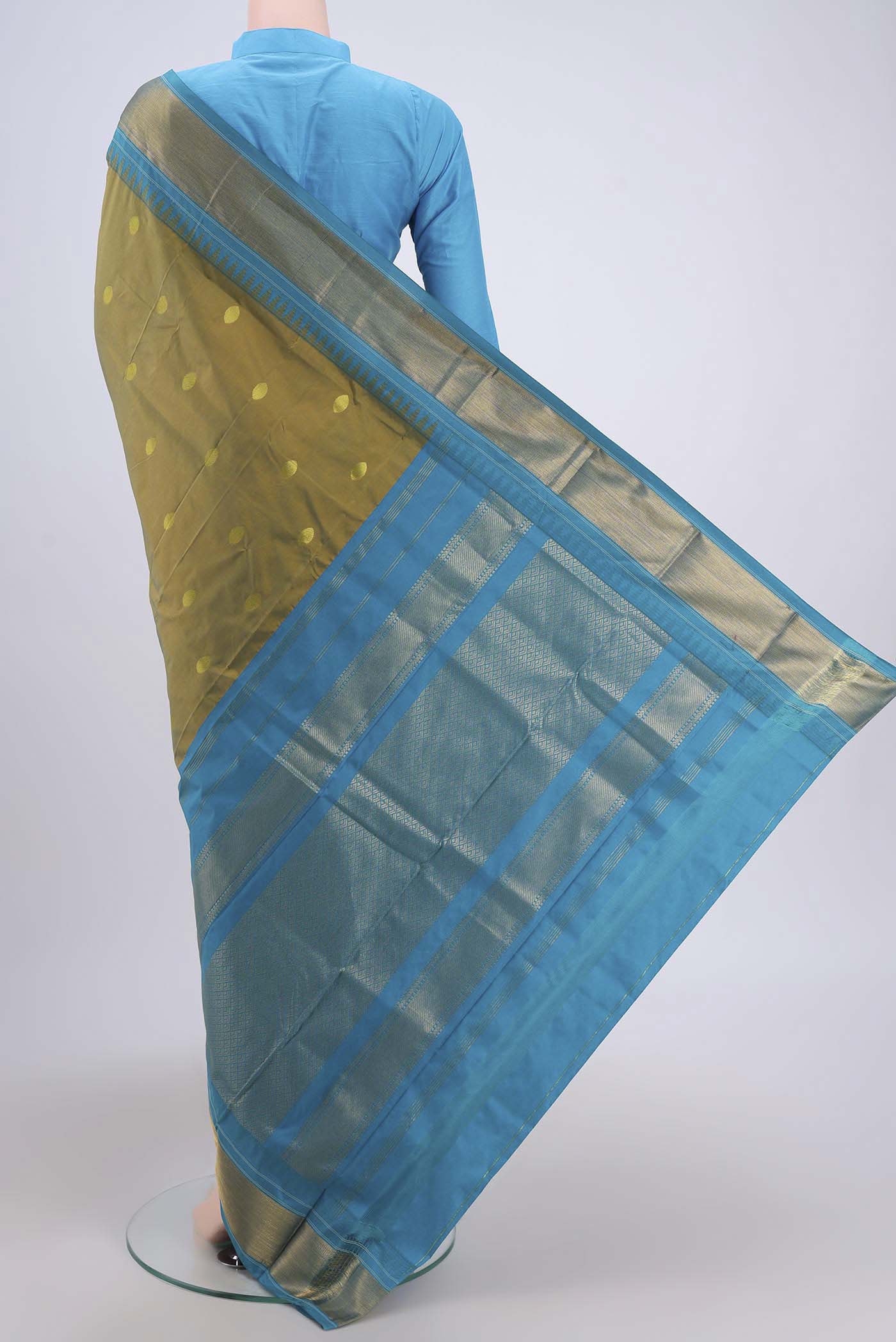 Flat view of Light Green Dual Tone Blended Bangalore Silk Saree with Zari Butta on the body and Temple Border. 