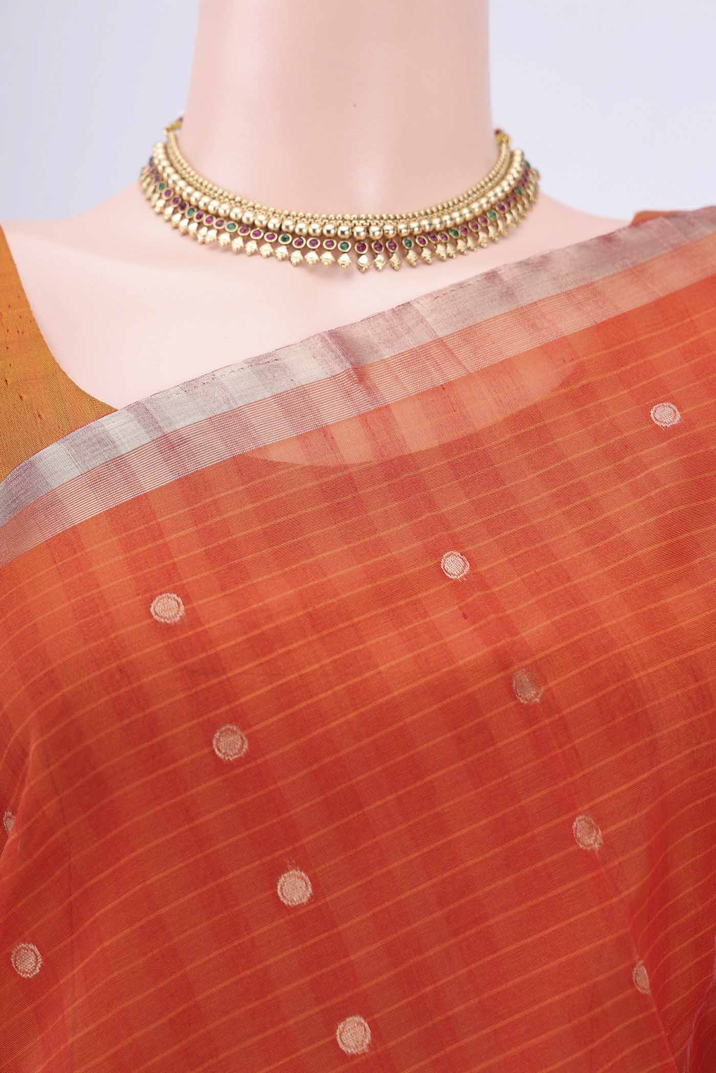 Border image of Brick Orange Kora Cotton Saree with Zari Butta on the body and Zari Border. 