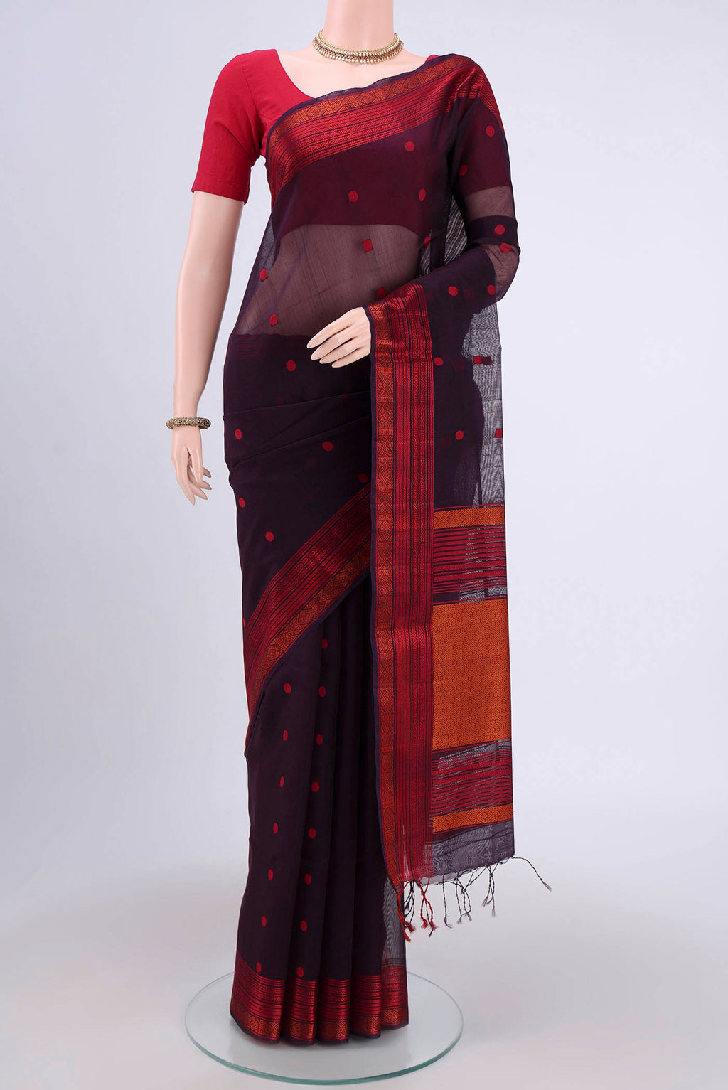 Dark Mauve Kora Cotton Saree with Zari Butta on the body and Zari Border.  displayed on a mannequin