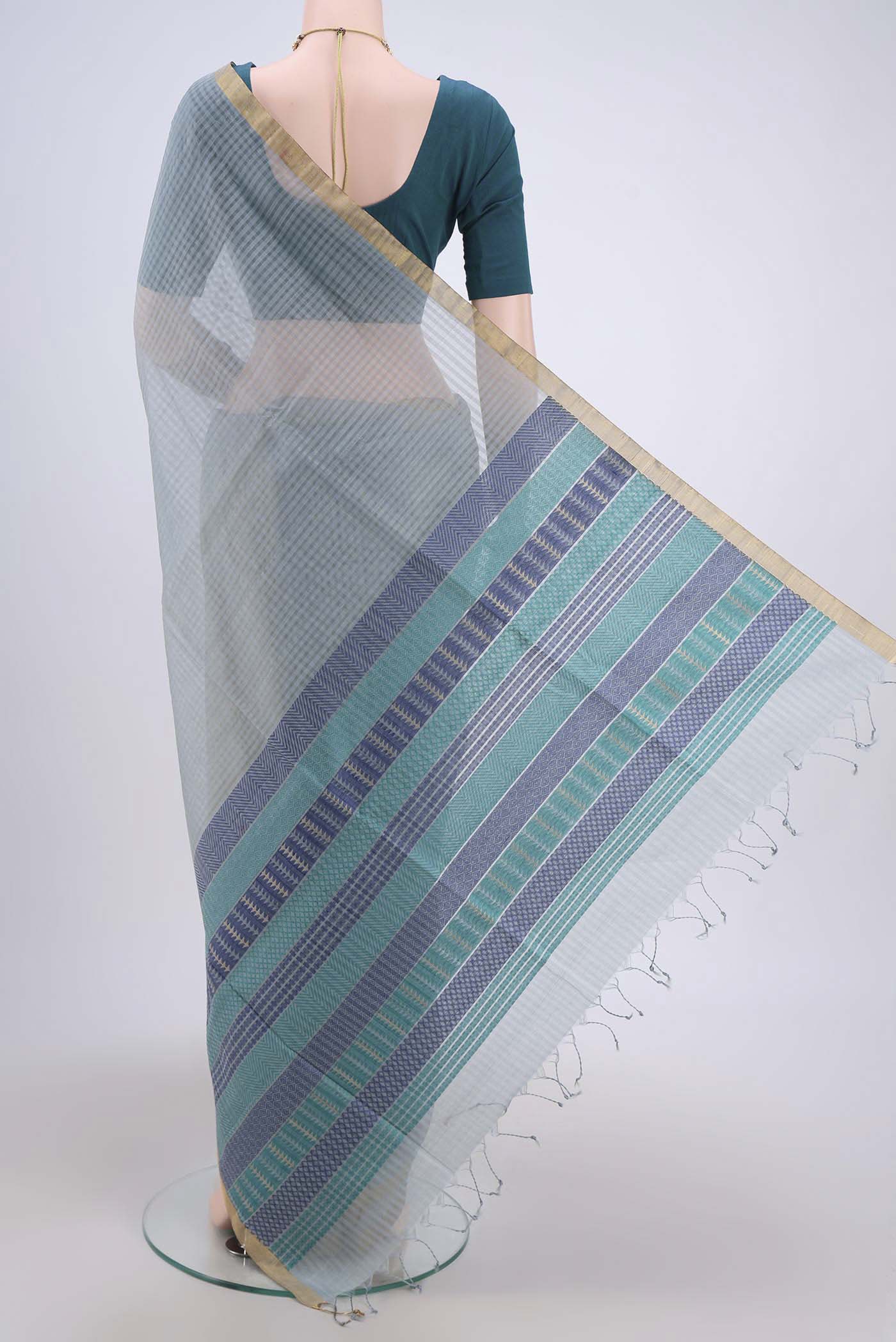 Flat view of Blue Grey Silk Cotton Saree with Plain Body and Zari Border. 