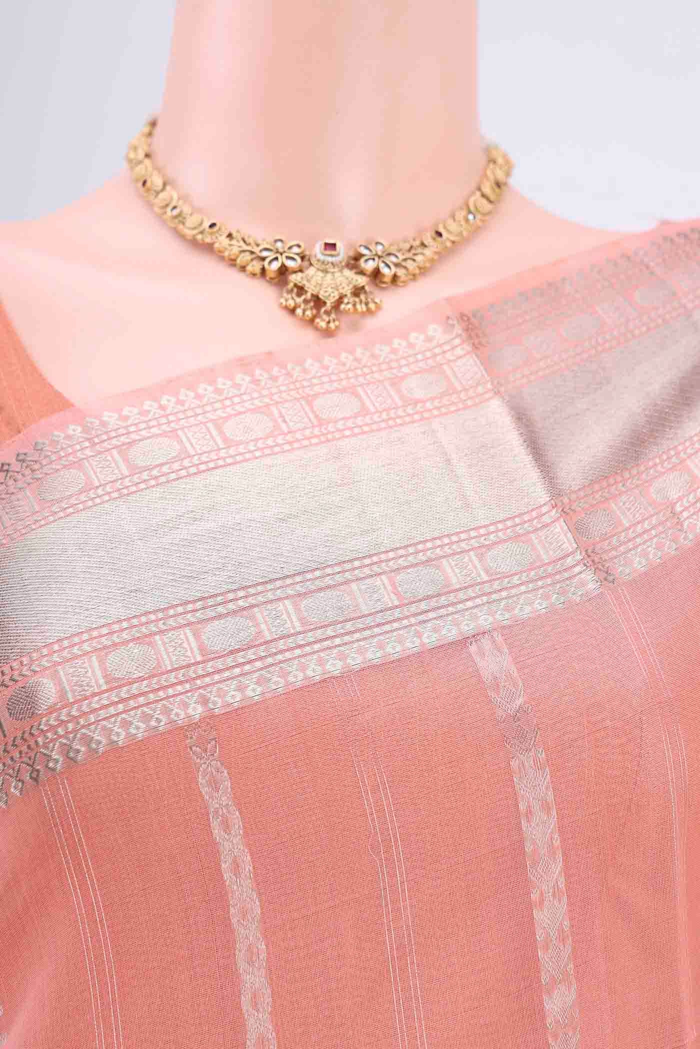 Border image of Peach Kora Cotton Saree with Zari Butta on the body and Zari Border. 