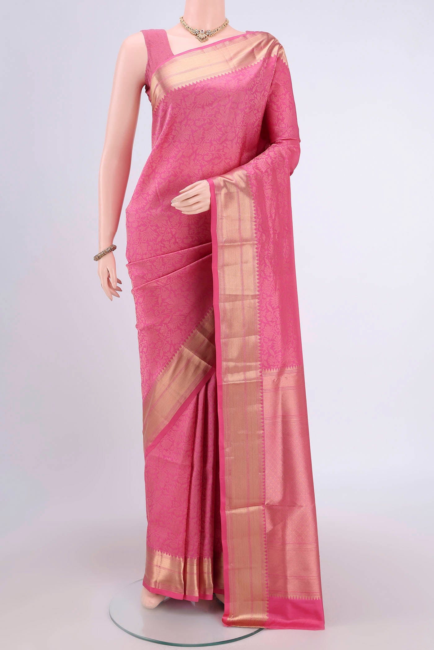 Pink Soft Silk Saree with Zari Brocade on the body and Zari Border.  displayed on a mannequin