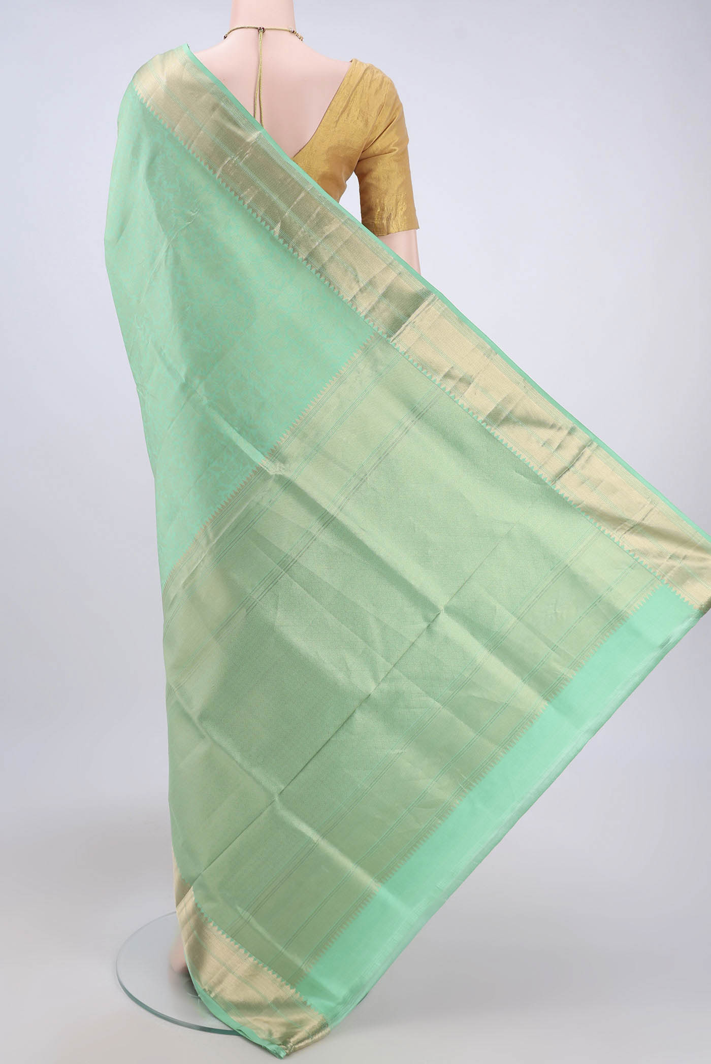 Flat view of Light Green Soft Silk Saree with Zari Brocade on the body and Zari Border. 