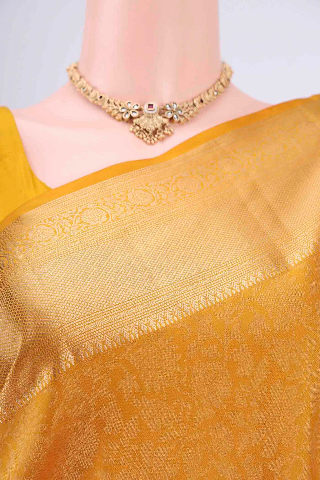 Border image of Mustard Soft Silk Saree with Zari Brocade on the body and Zari Border. 