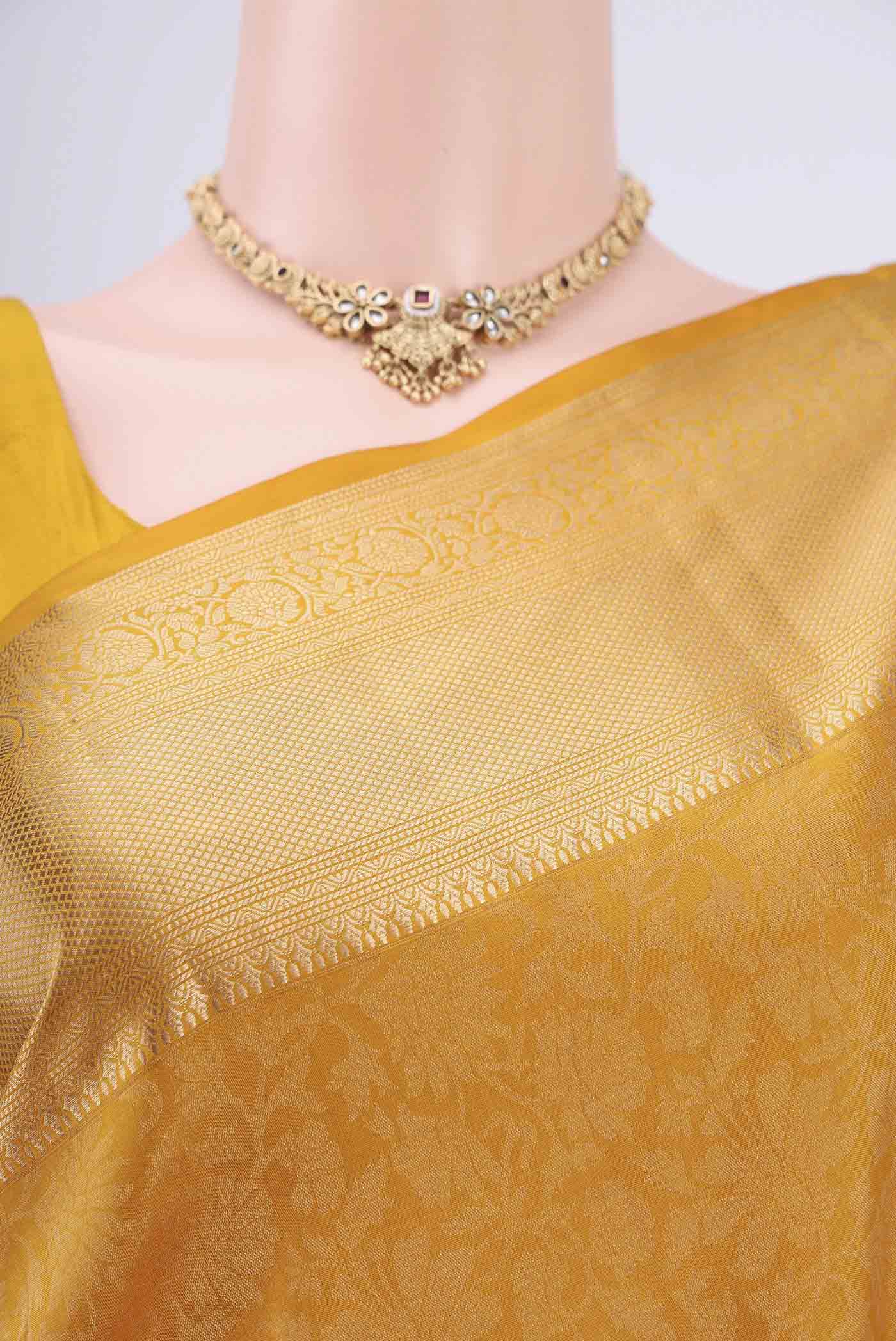 Border image of Mustard Soft Silk Saree with Zari Brocade on the body and Zari Border. 