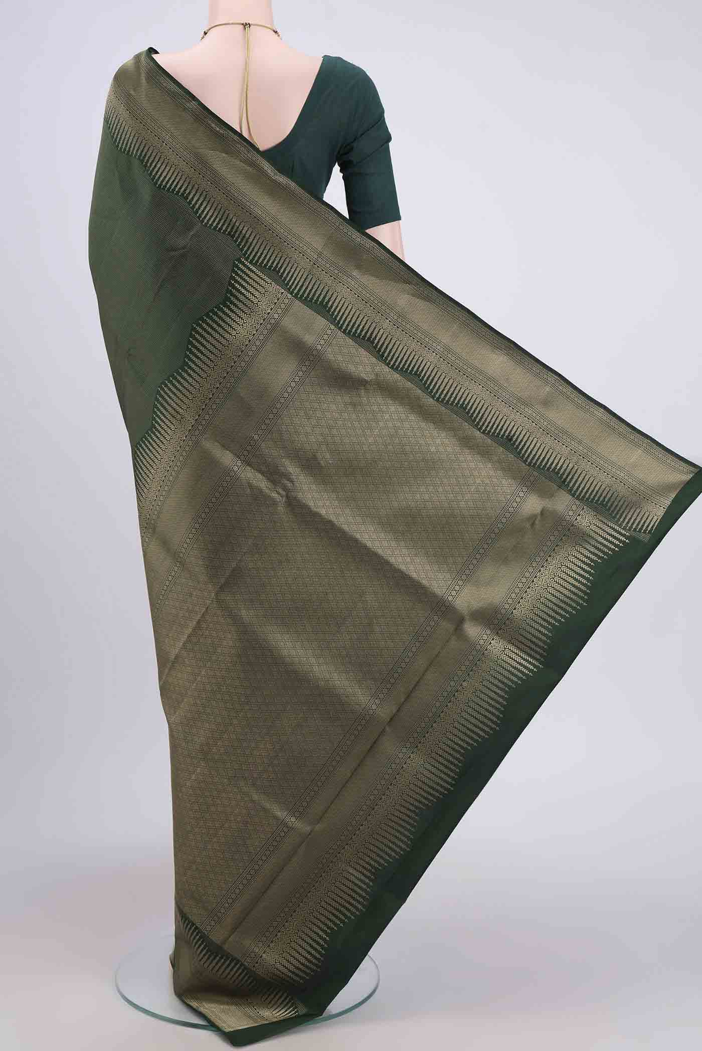 Flat view of Bottle Green Soft Silk Saree with Checked design on the body and Zari Border. 