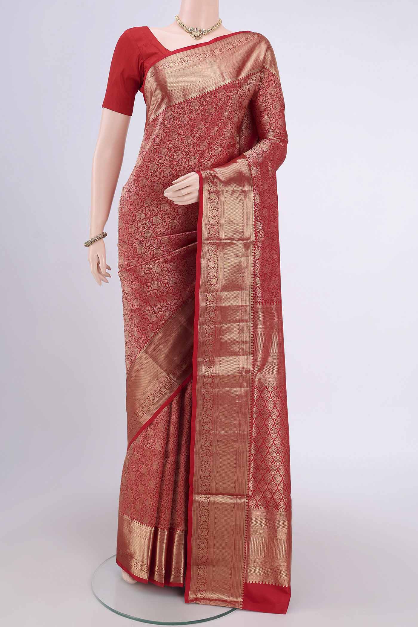 Red Soft Silk Saree with Zari Brocade on the body and Zari Border.  displayed on a mannequin