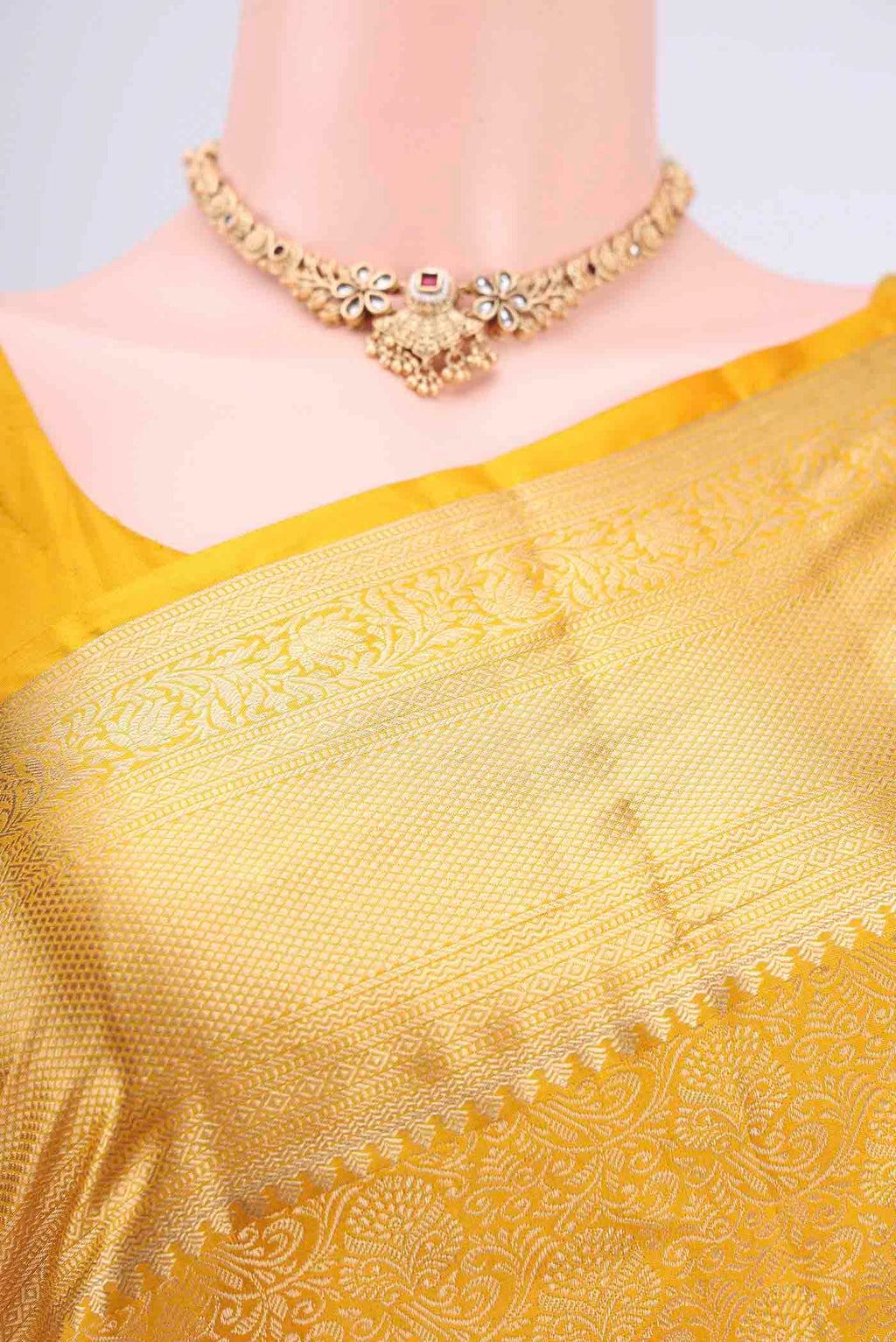 Border image of Mustard Soft Silk Saree with Zari Brocade on the body and Zari Border. 