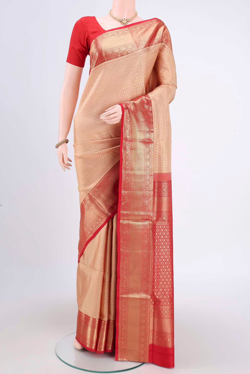 Rose Gold Soft Silk Saree with Zari Brocade on the body and Zari Border.  displayed on a mannequin