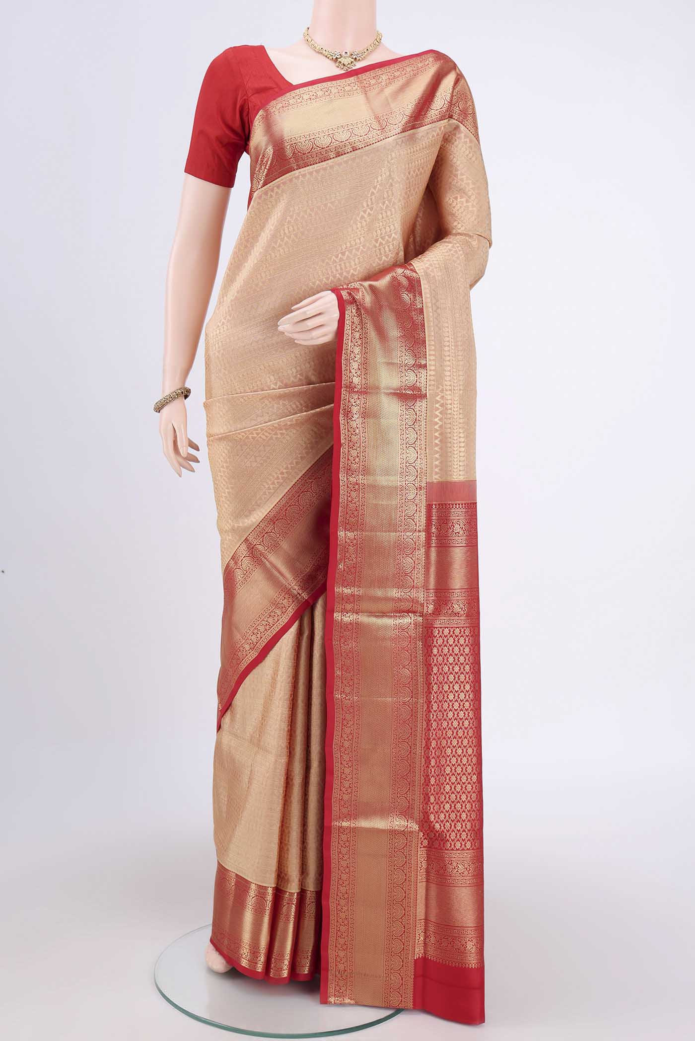 Rose Gold Soft Silk Saree with Zari Brocade on the body and Zari Border.  displayed on a mannequin