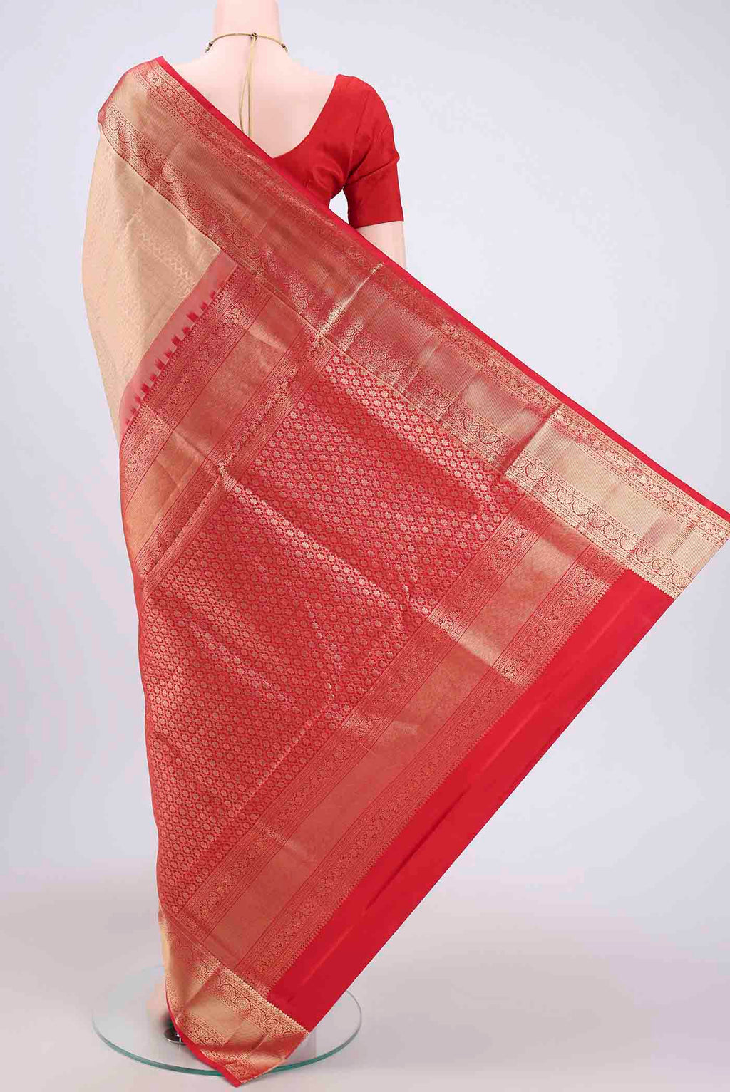 Flat view of Rose Gold Soft Silk Saree with Zari Brocade on the body and Zari Border. 