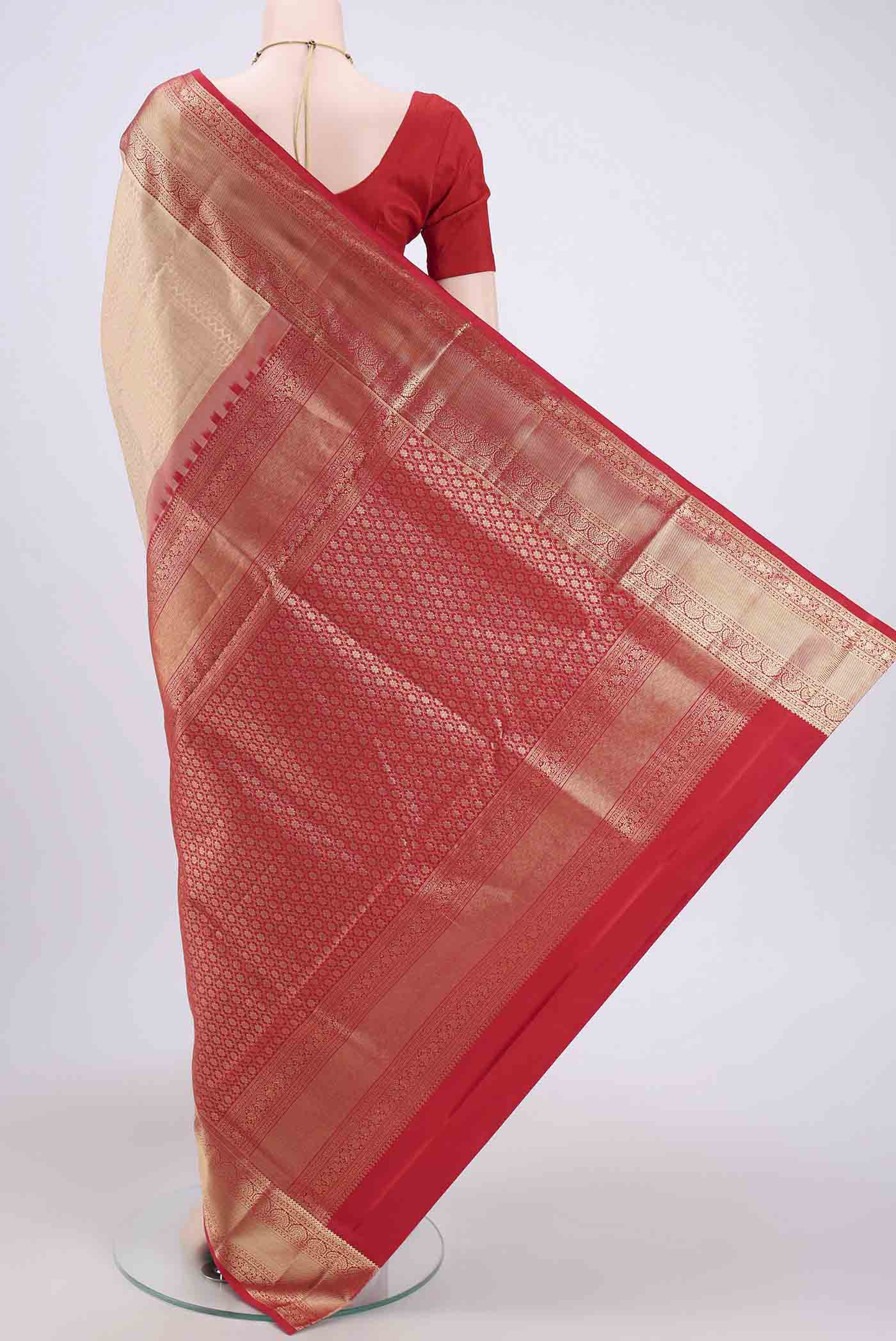 Flat view of Rose Gold Soft Silk Saree with Zari Brocade on the body and Zari Border. 