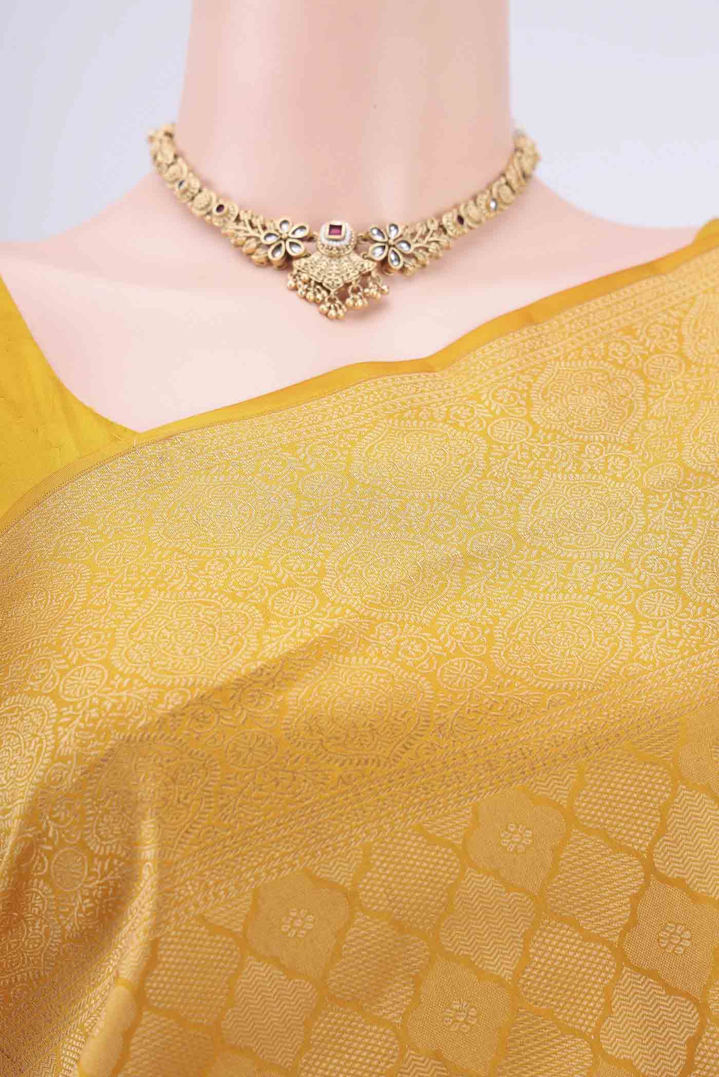 Border image of Mustard Soft Silk Saree with Zari Brocade on the body and Zari Border. 