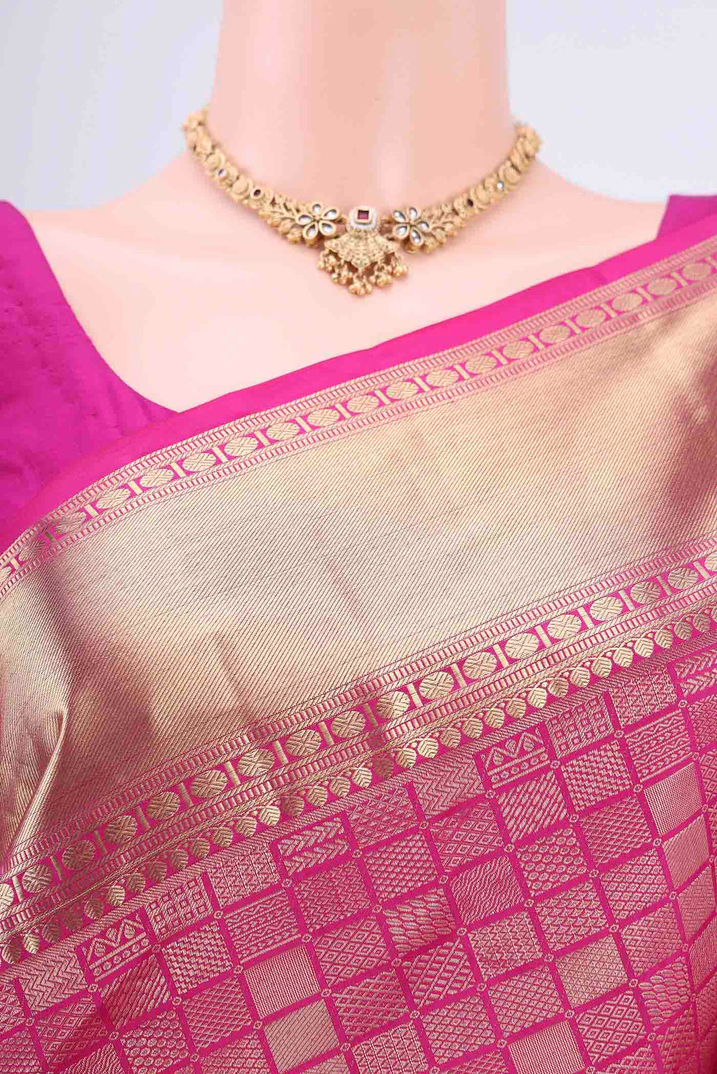 Border image of Rani Pink Soft Silk Saree with Zari Brocade on the body and Zari Border. 
