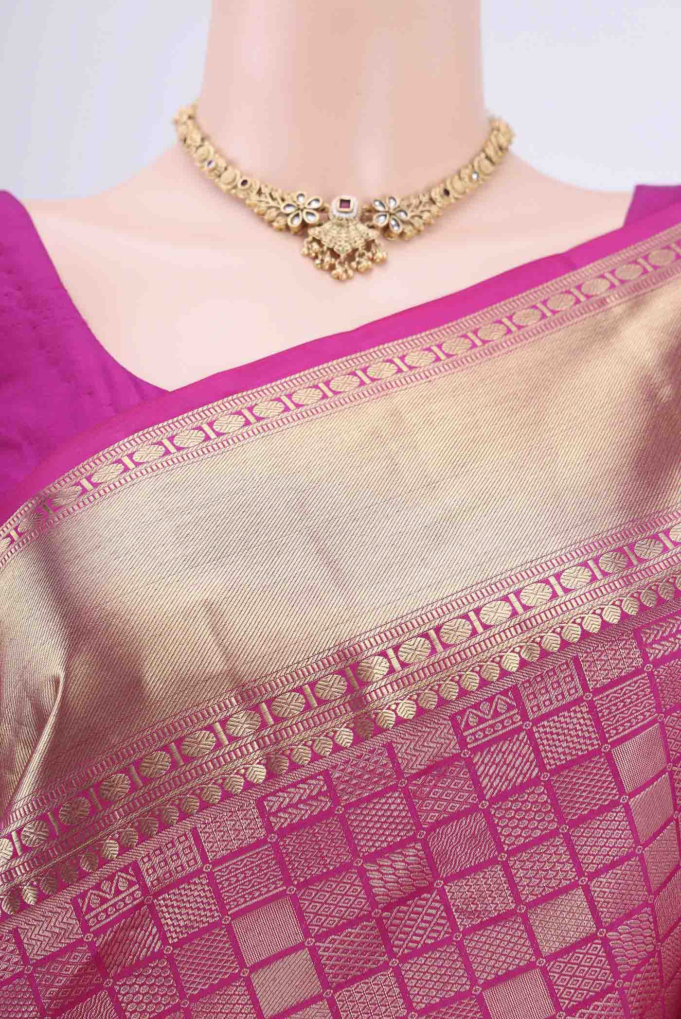 Border image of Rani Pink Soft Silk Saree with Zari Brocade on the body and Zari Border. 