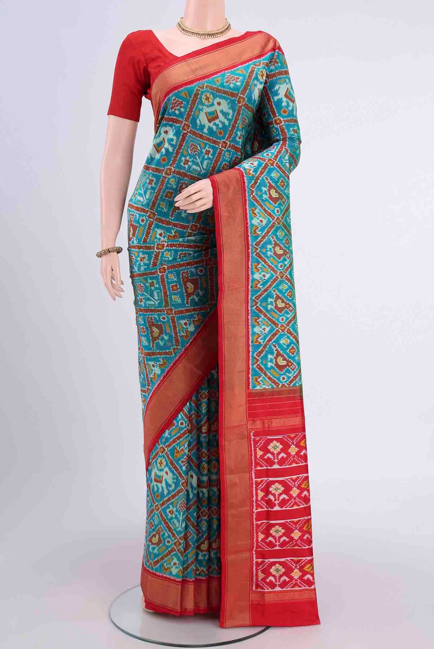 Blue Pochampally Silk Saree with Pure Ikat on the body and Zari Border displayed on a mannequin