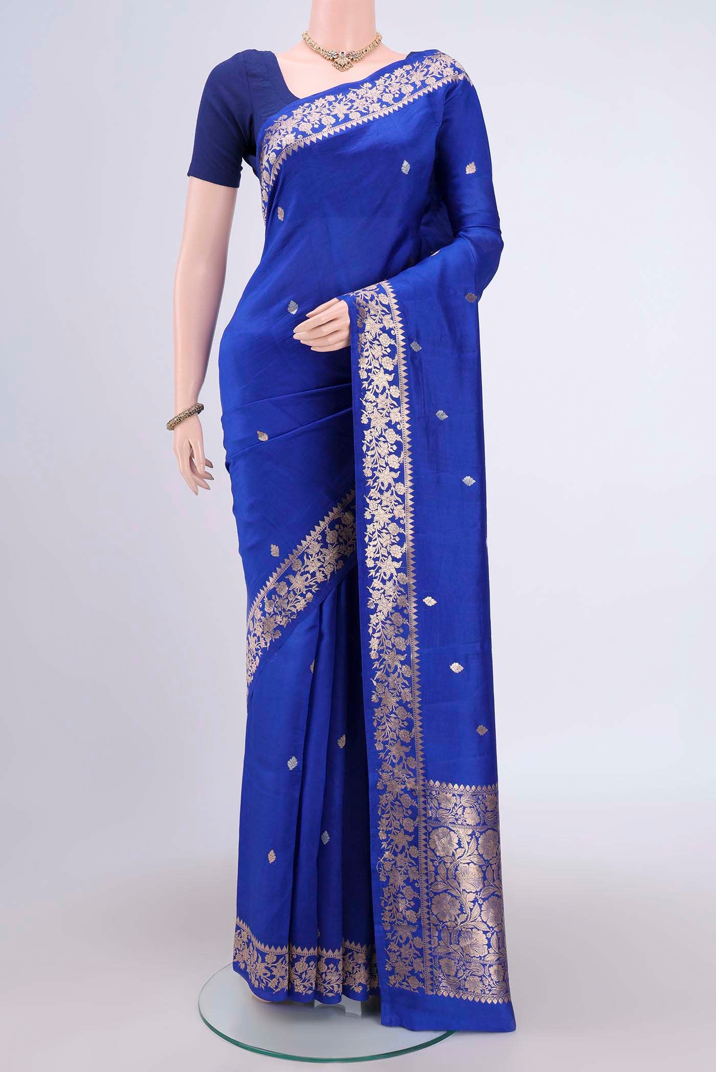 Royal Blue Banarasi Katan Silk Saree with Zari Butta on the body and Zari Border.  displayed on a mannequin