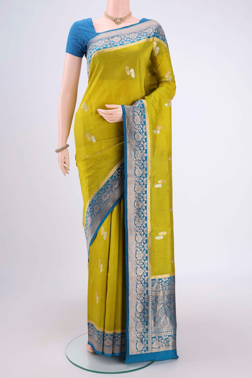 Parrot Green Banarasi Saree with Zari Brocade on the body and Plain Border.  displayed on a mannequin