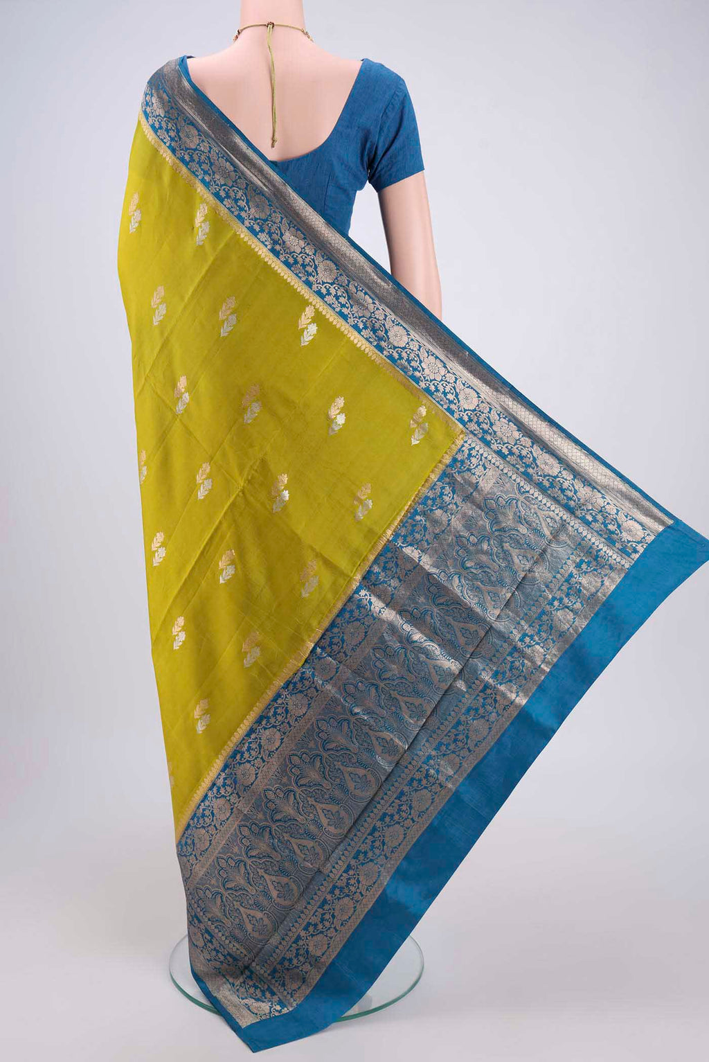 Flat view of Parrot Green Banarasi Saree with Zari Brocade on the body and Plain Border. 