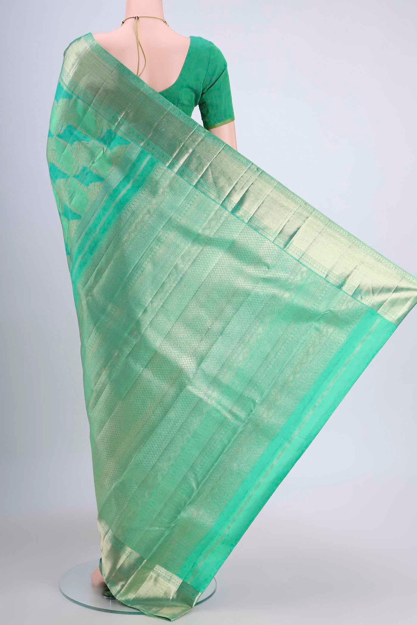 Flat view of Mint Green Dual Tone Kanchipuram Saree with Zari Brocade on the body and Zari Border