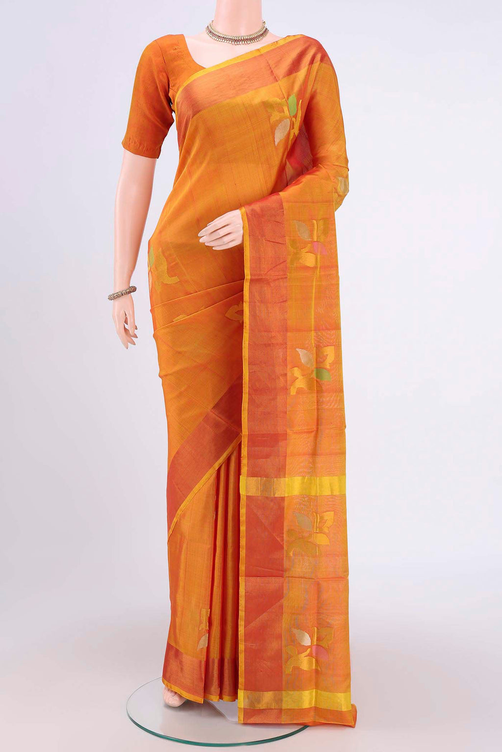 Yellow Uppada Silk Saree with Zari Butta on the body and Zari Border.  displayed on a mannequin